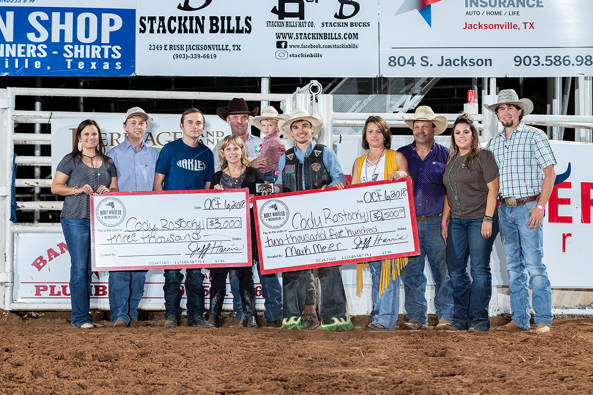 The Wheeler, Beasley, and Harris families with event champion Cody Rostockyj and Tuff Hedeman