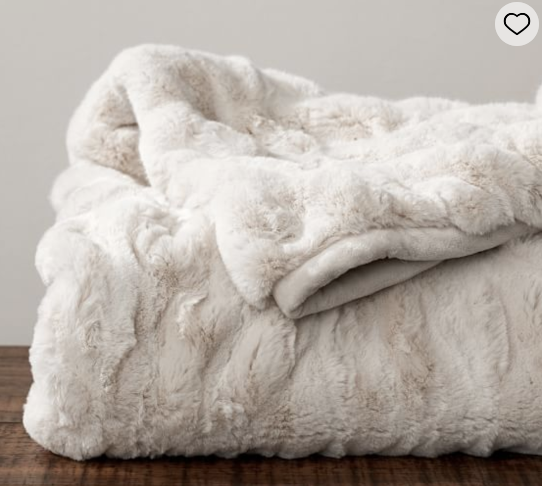 Pottery Barn Faux Fur Throw This gift is a little pricey and indulgent, but oh my goodness is it one of the best inventions this world has ever seen. We got one for Christmas 3 years ago and it remains the best blanket I've ever had. We call it the "bear blanket" and when you are using it you feel like you're wrapped in the softest coziest bear hug. I can honestly say this has ridden out many a migraine with me and one of my favorite items.