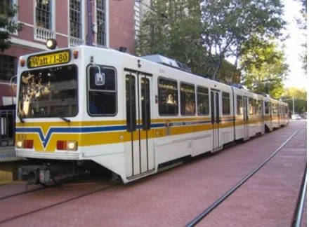City prohibits gas stations, relaxes parking requirements, next to light rail stations 
