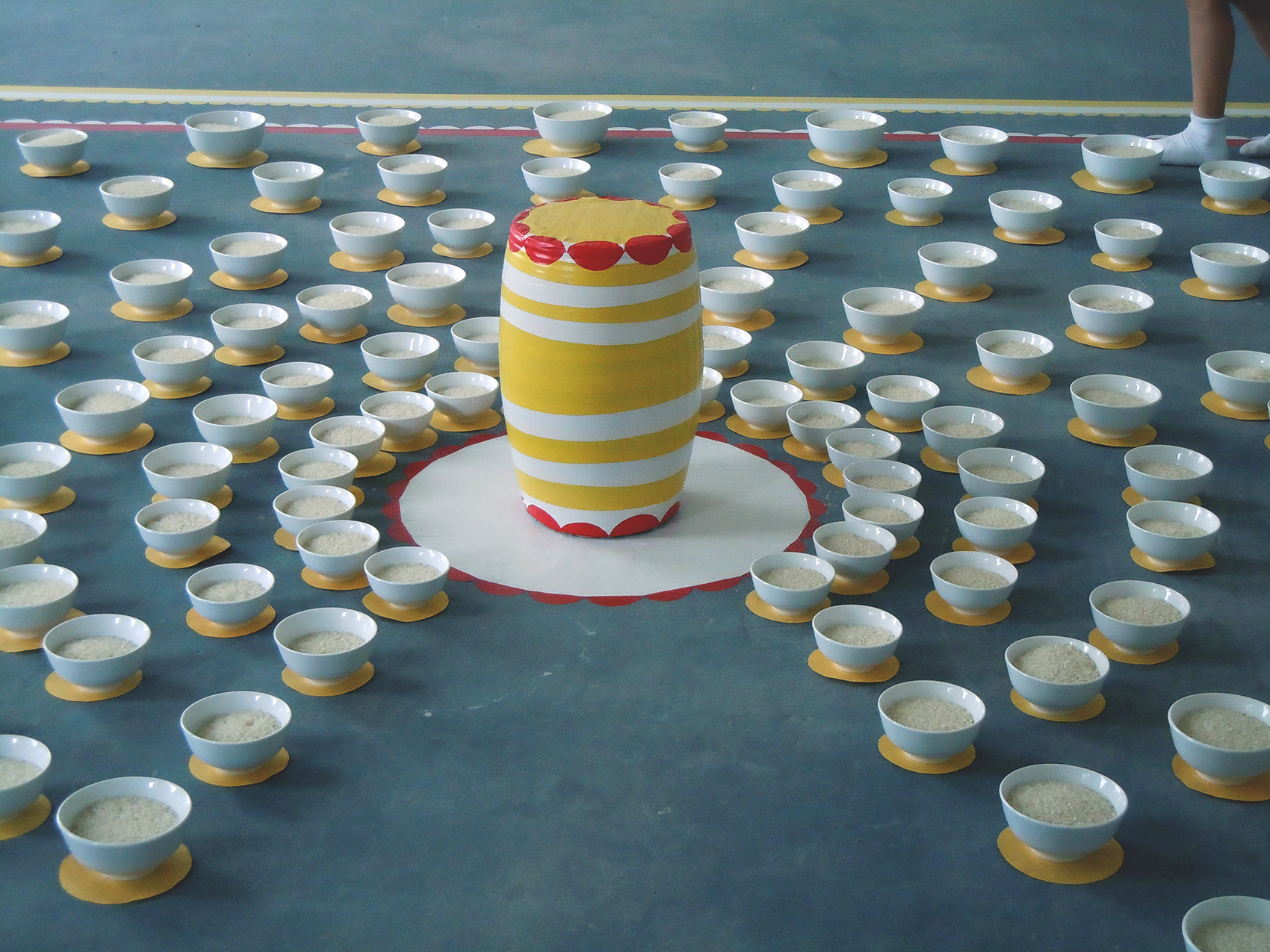   The Feast of Rice Gods and Goddesses, vary, ceramic bowls, rice, contact paper, cement stool, 2010   