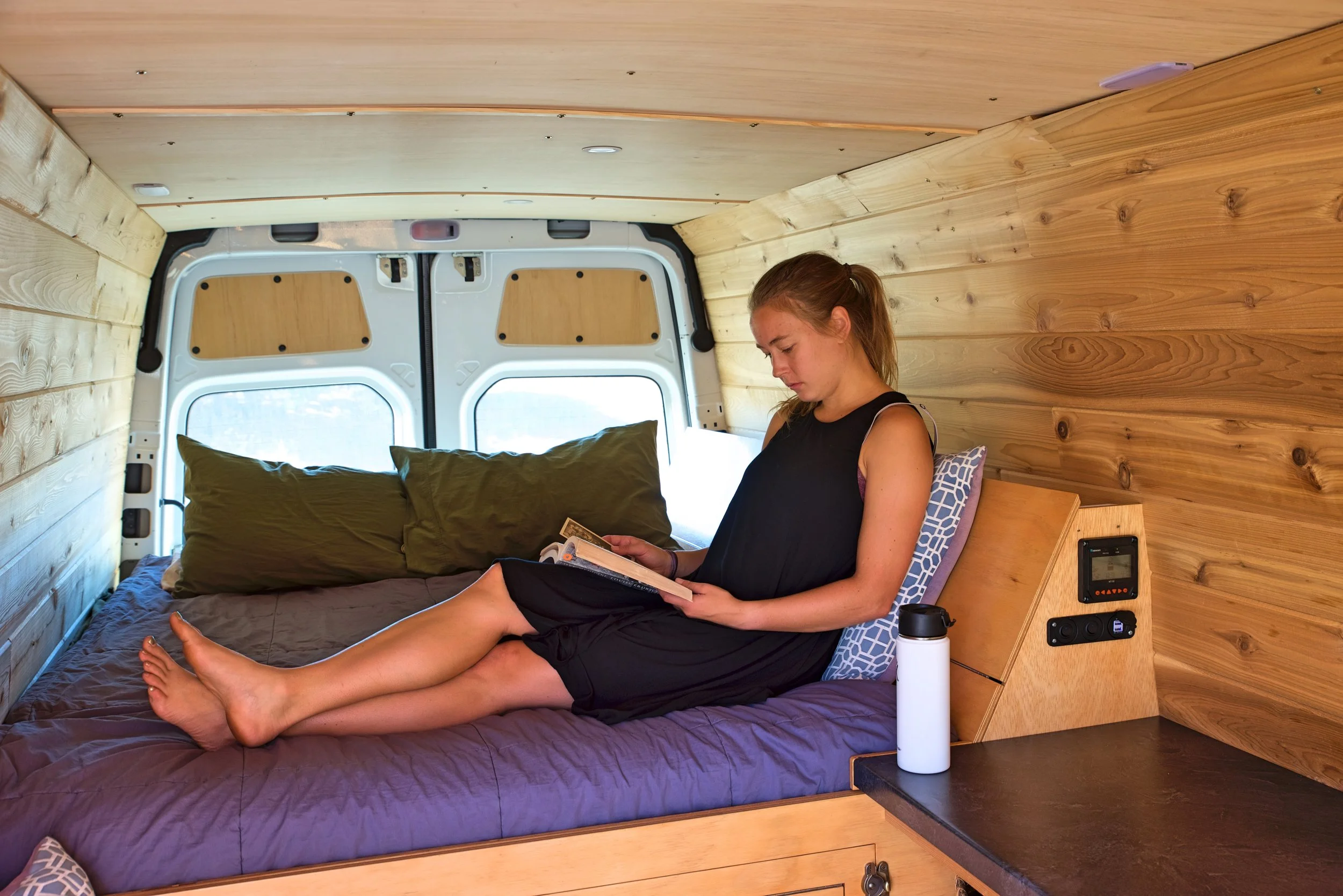 We think the final ceiling with the trim going across looks very clean. We are very happy with the lauan plywood and how it matches the rest of the van.