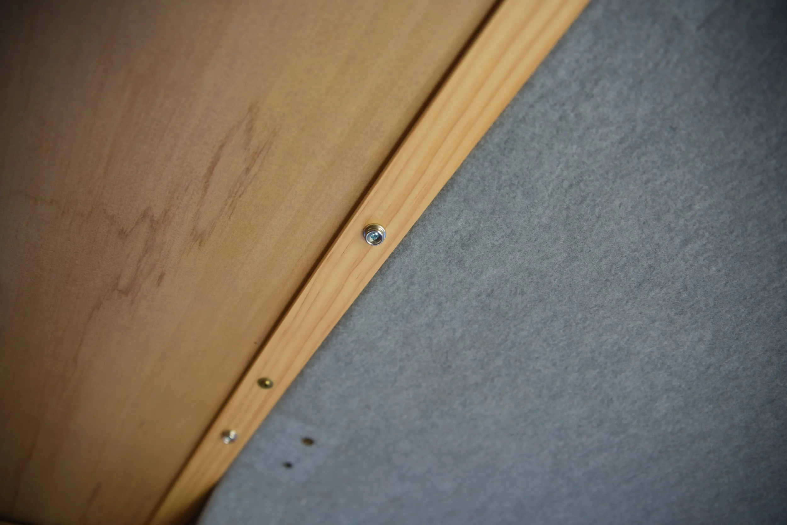 We added a piece of trim where the panels meet the headliner, and this is the piece we used to attach the snap fasteners that we hang our insulated curtains from.