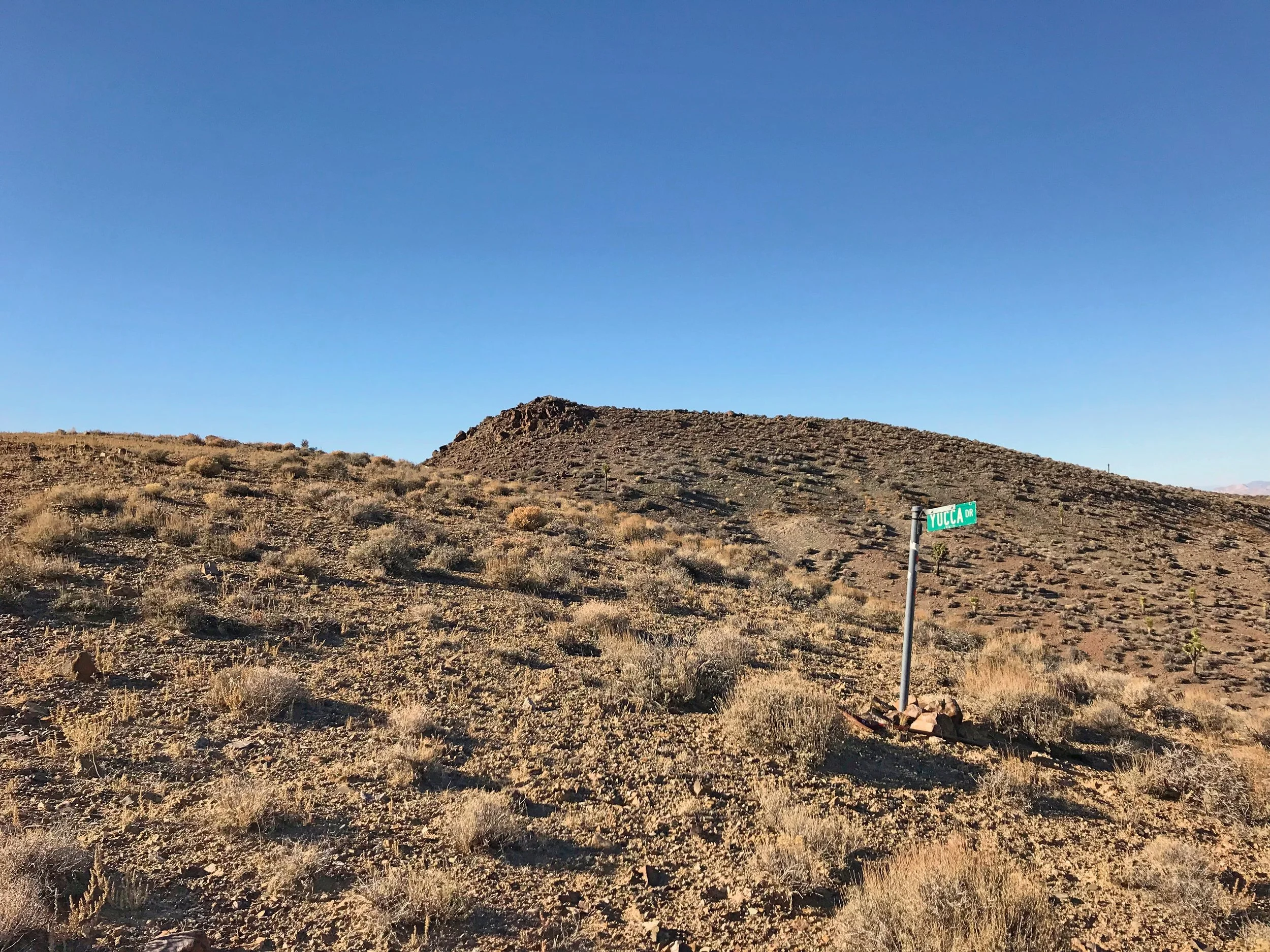 We spotted this random road sign for Yucca Dr. on top of a ridge nowhere close to a road while we were running around the International Car Forest.