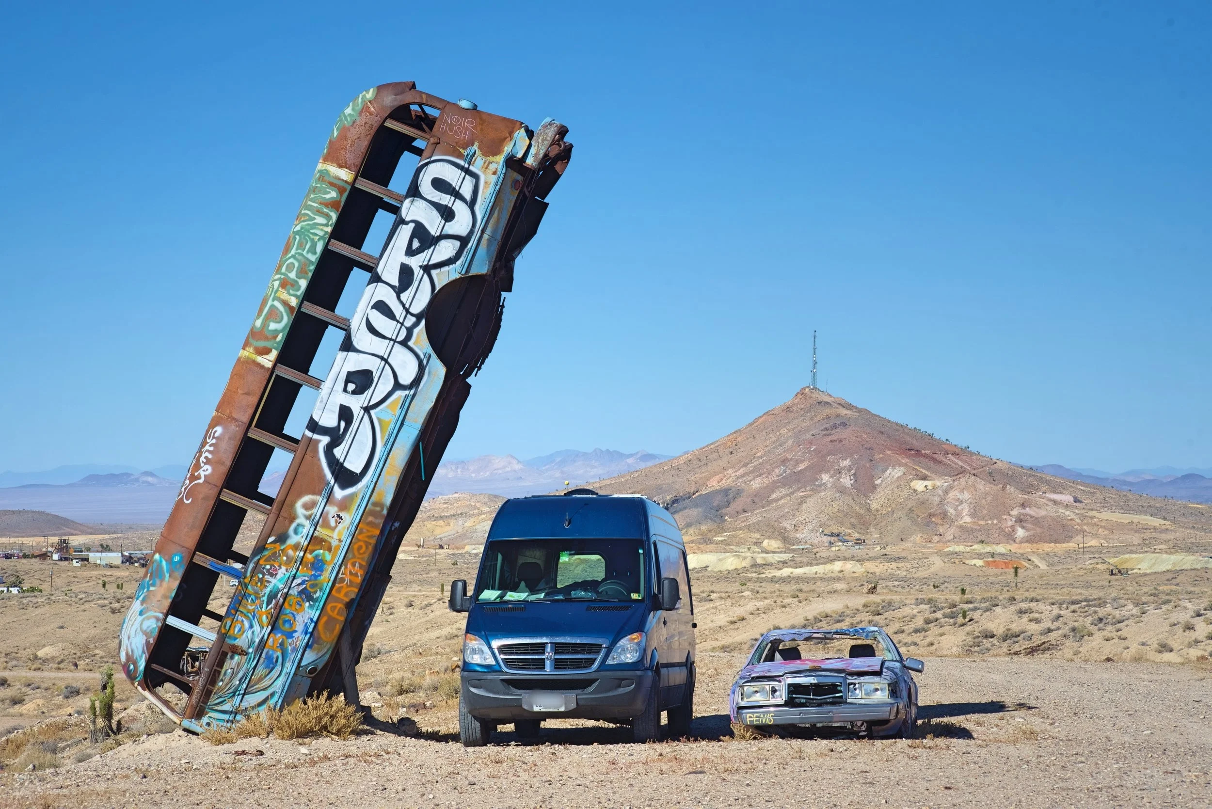 I was really afraid this bus would fall on our van. We did not leave the van parked here while we were running!