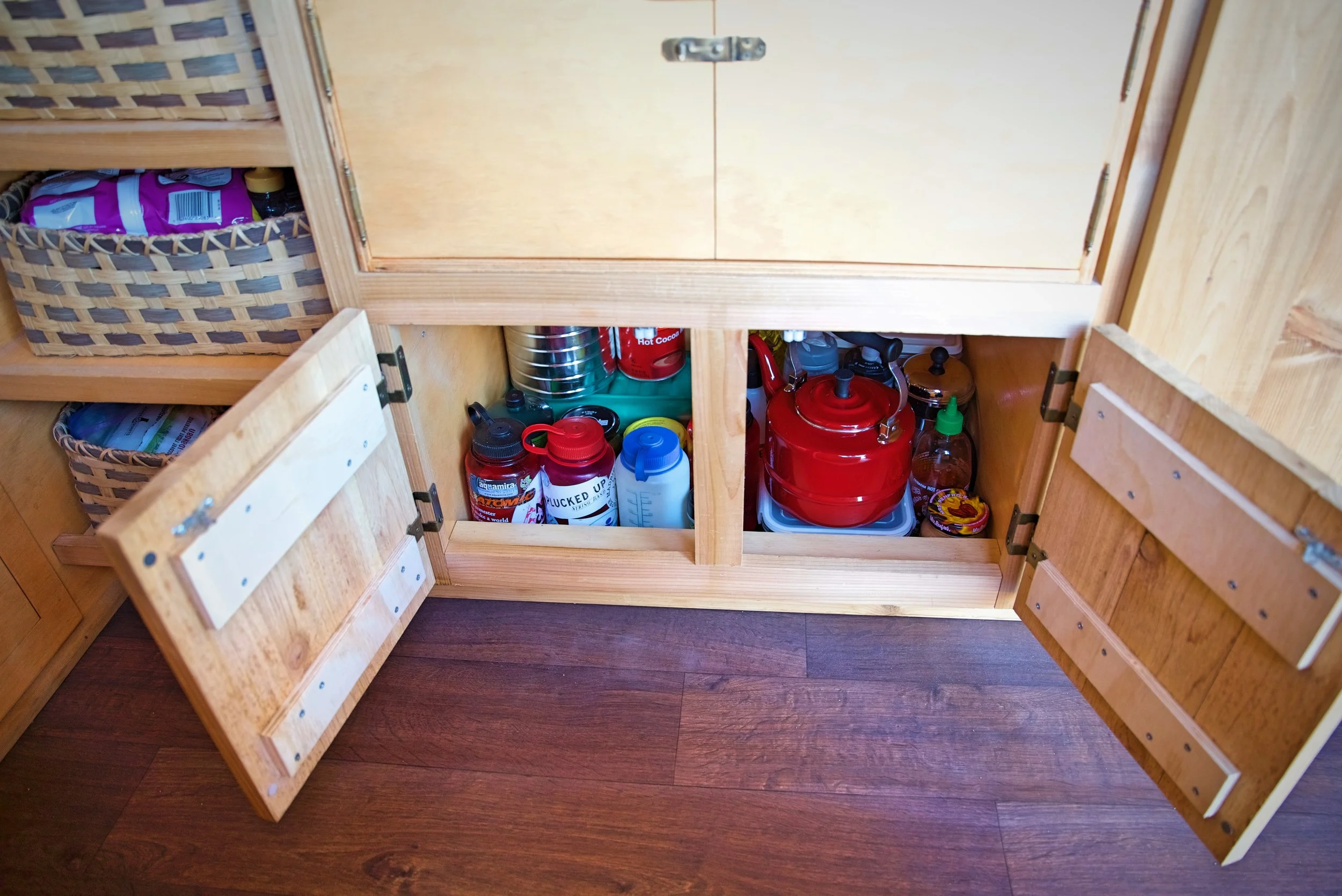 Under our chuck box we have a large storage area for things like our tea kettle and water bottles.