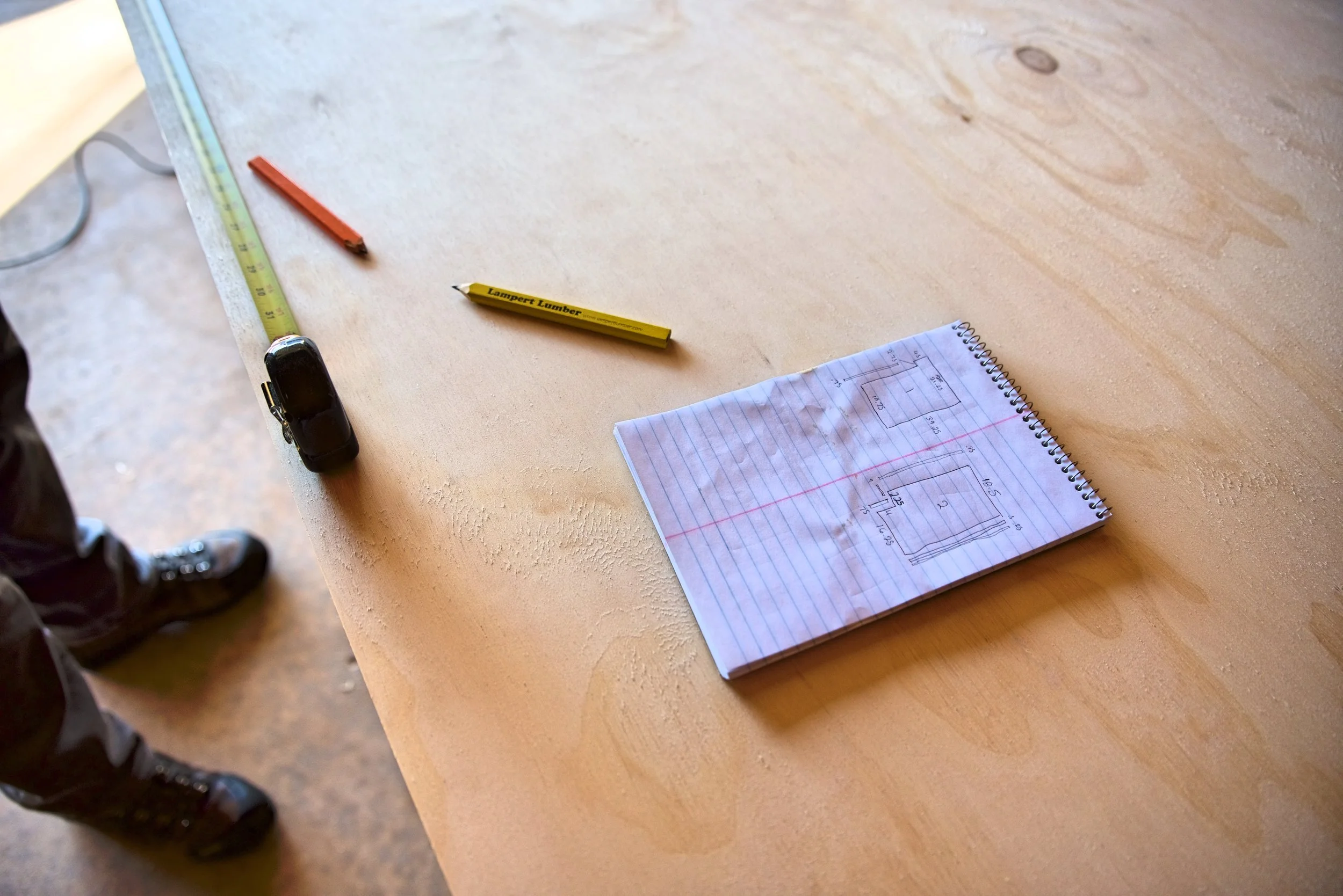 Here you can see the pieces we needed for the walls of our cabinet cases—basic plywood rectangles with the toe kick cut out.