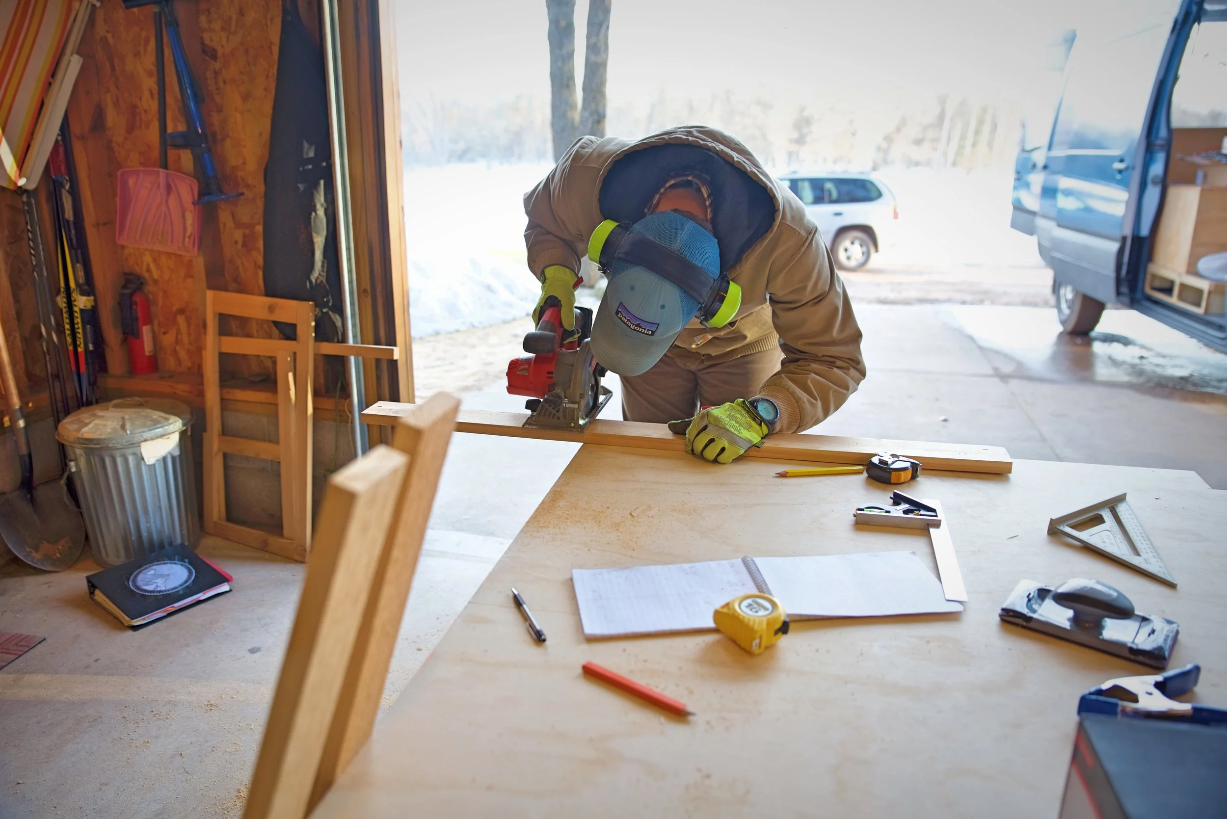 Ian cuts a piece of cedar to the right length for our face frame using his circular saw.