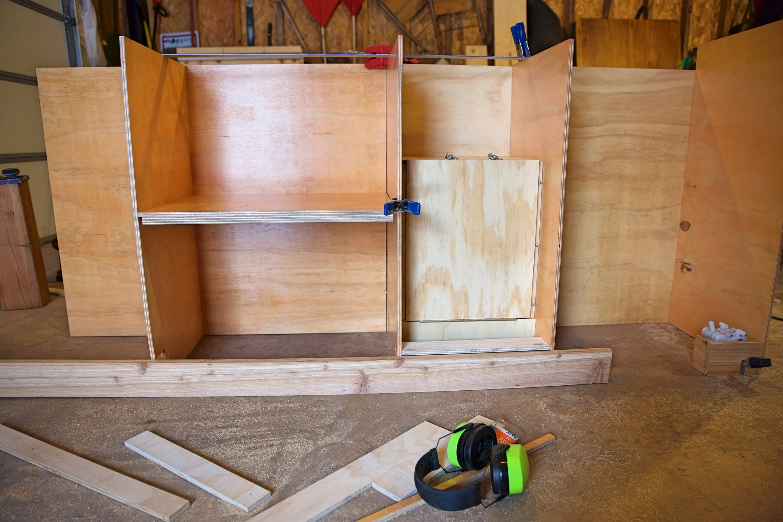 In this photo you can see how the toe kick is built into the cabinets rather than the cabinets sitting atop a hollow base.