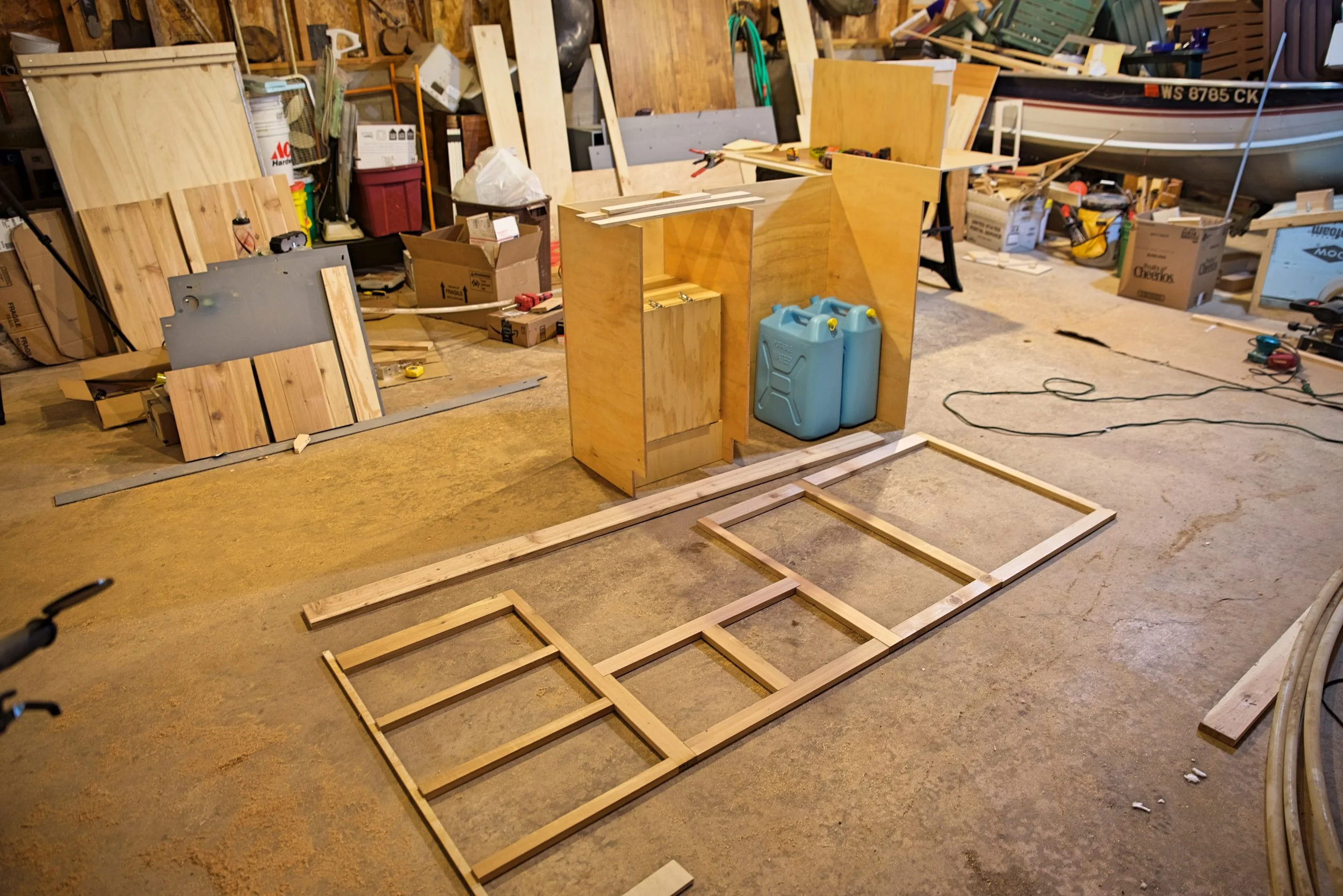 Here is the finished face frame laid out in front of the cabinet cases.