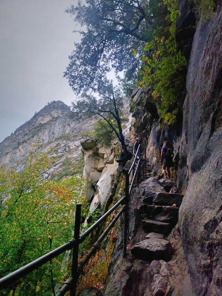 Hiking some stairs built into a rock face on the Mist Trail on the way to Half Dome.