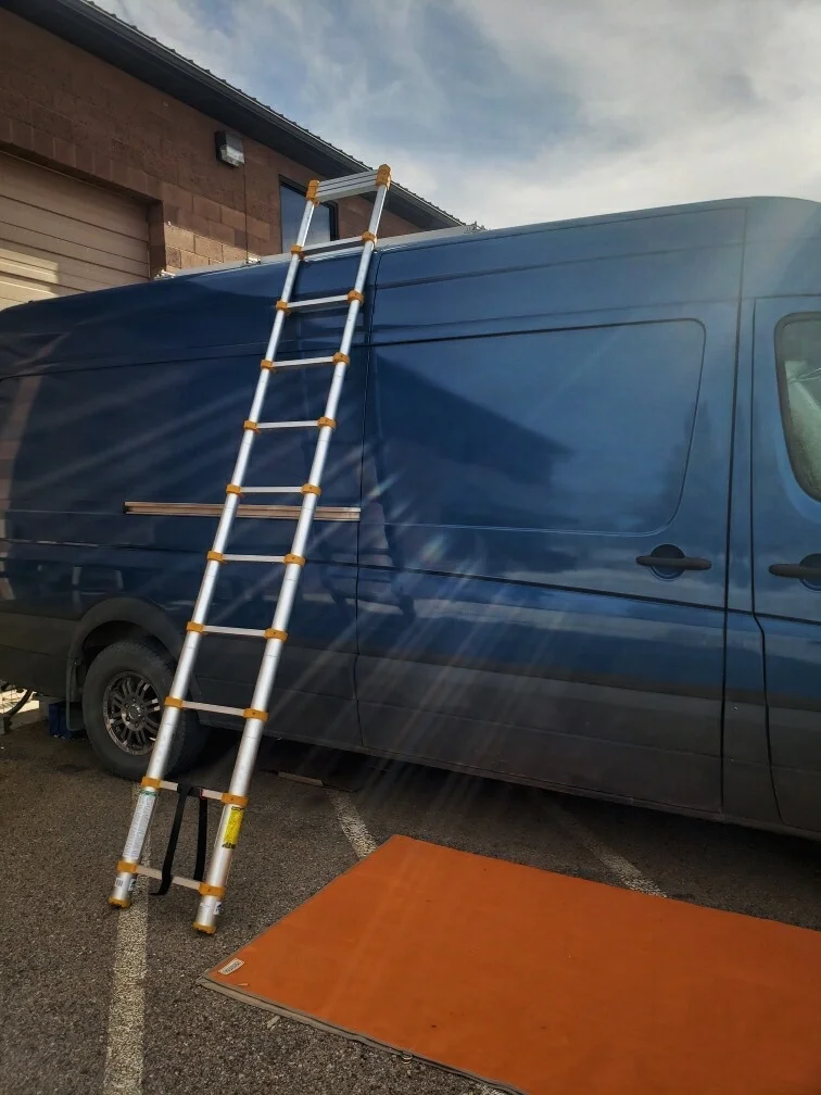 The ladder extends to 12.5 feet, so we can easily get on top of our van whenever we need to clean our solar panels.