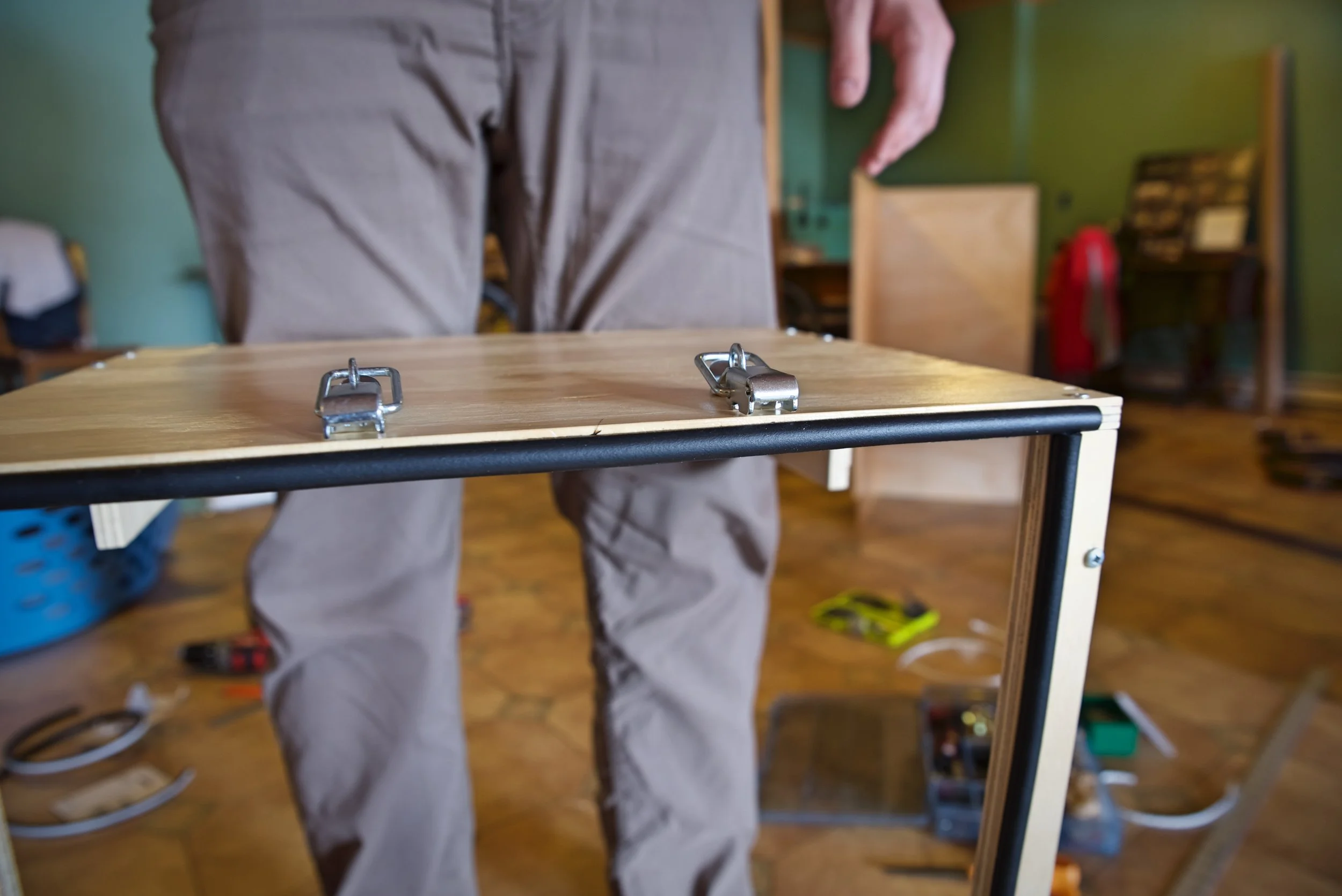 We put weather stripping all the way around the frame of the door. When the door is closed, it compresses the rubber tape to make a seal.