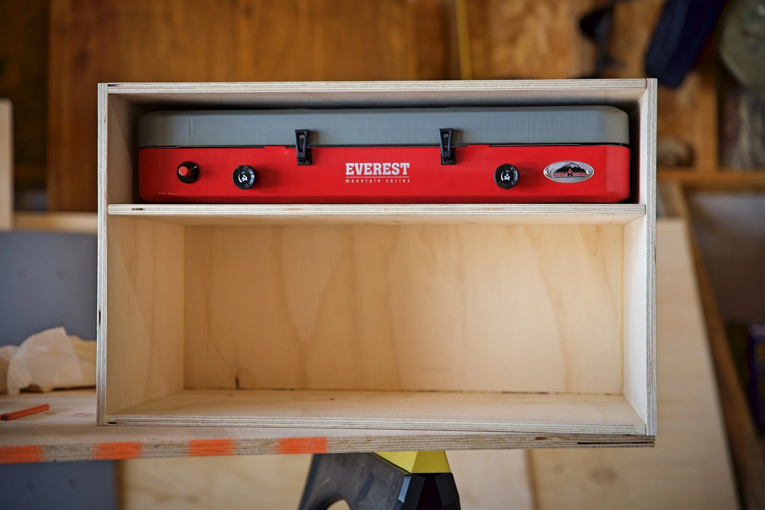 Our chuck box is just a simple plywood box with two compartments. This entire box can be removed for outdoor cooking.