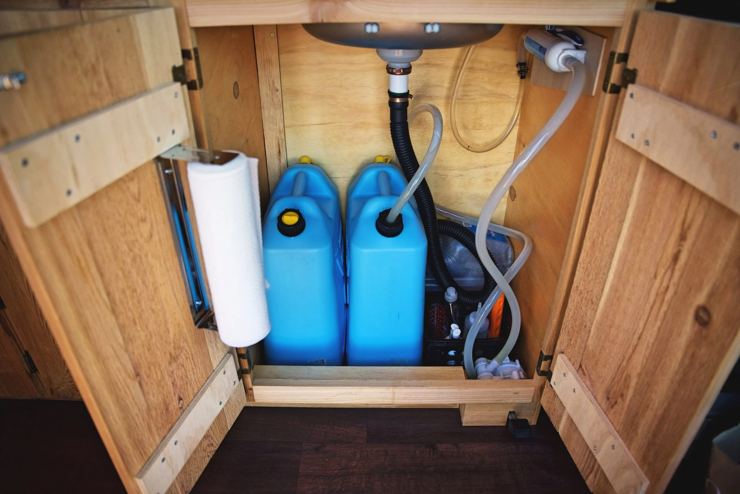 Our entire water system is contained within this cabinet under the sink. These ten gallons usually last one to two weeks.