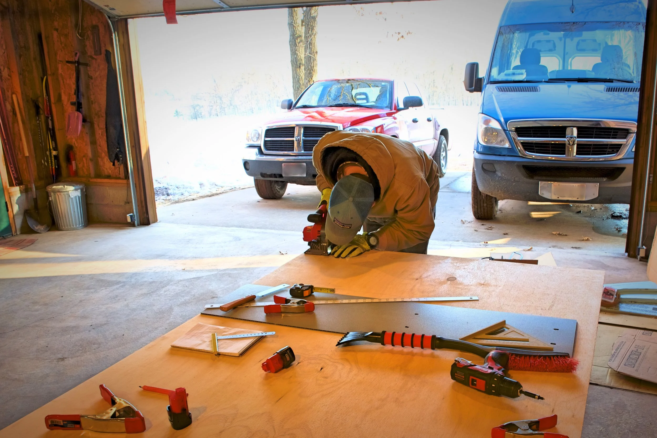 Ian cuts the corner off one of the walls of the case in order to accommodate our toe kick.