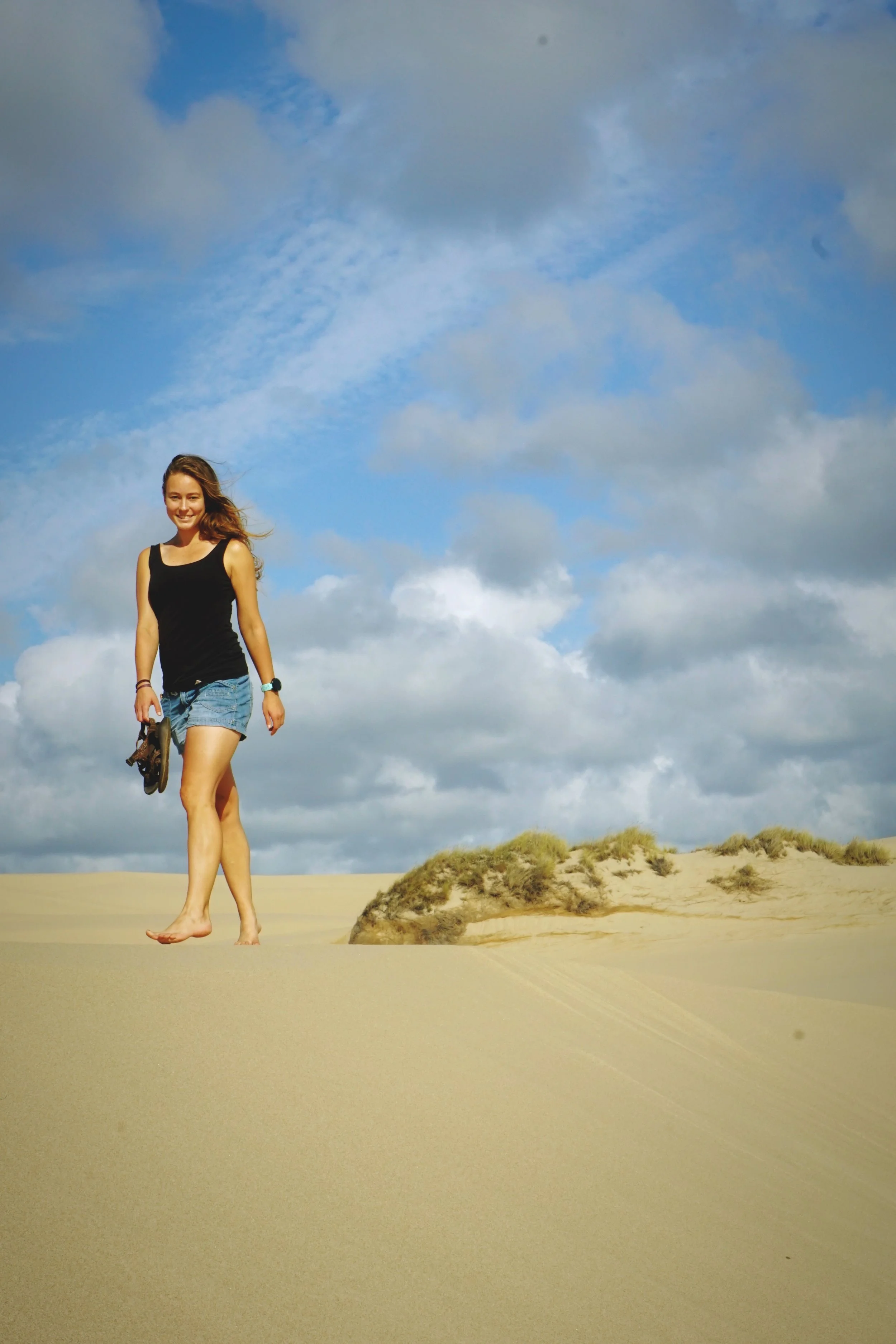 You might not want to walk the whole way barefoot, but take your shoes off at some point.