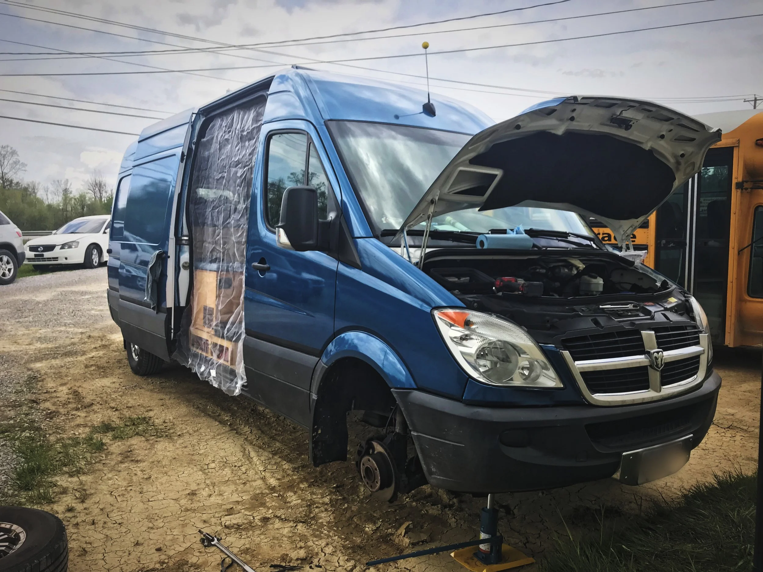 Ian repairing our van while we were in Kentucky.