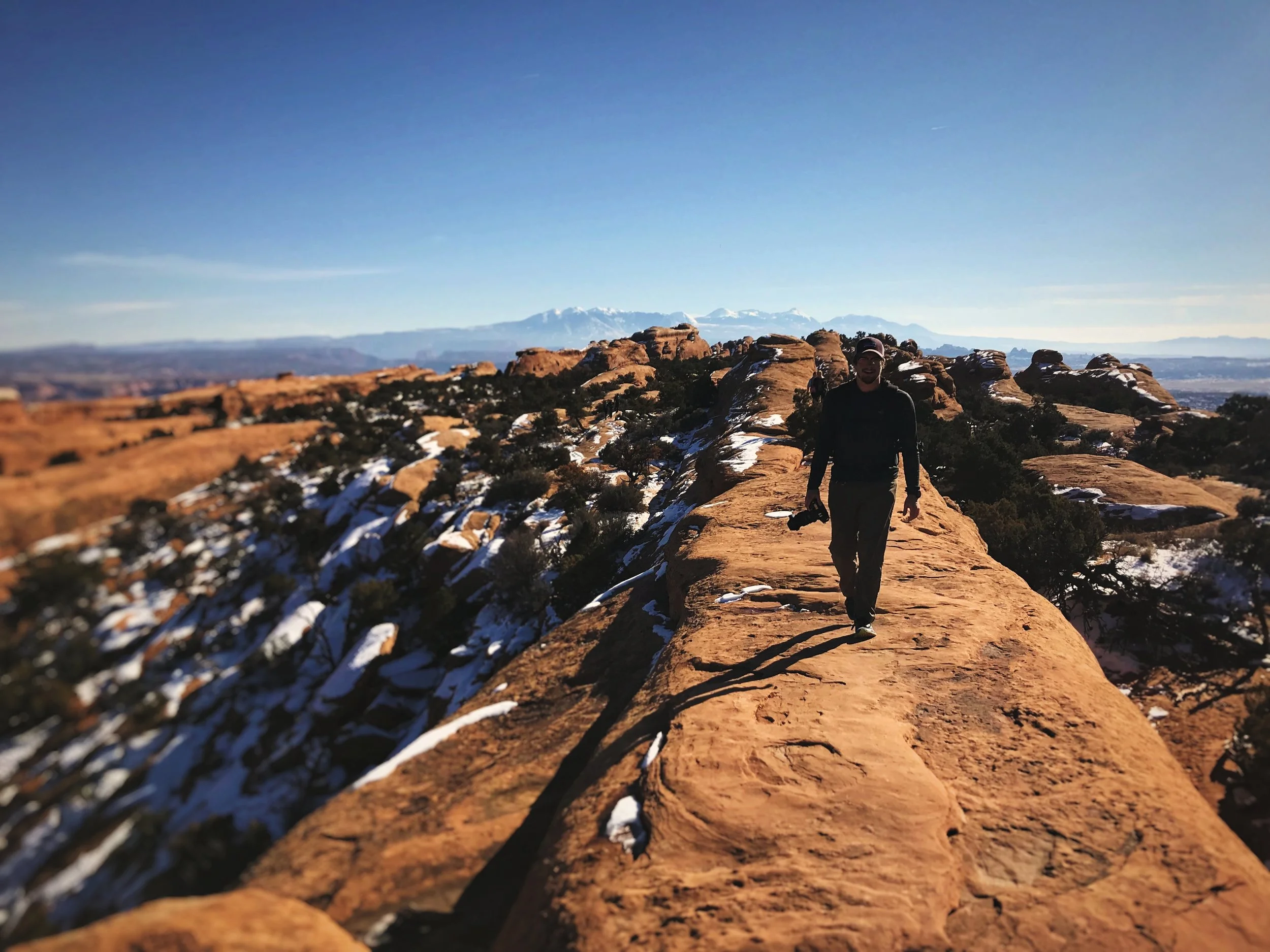 Ian walks on a sandstone fin on the Devils Garden trail.