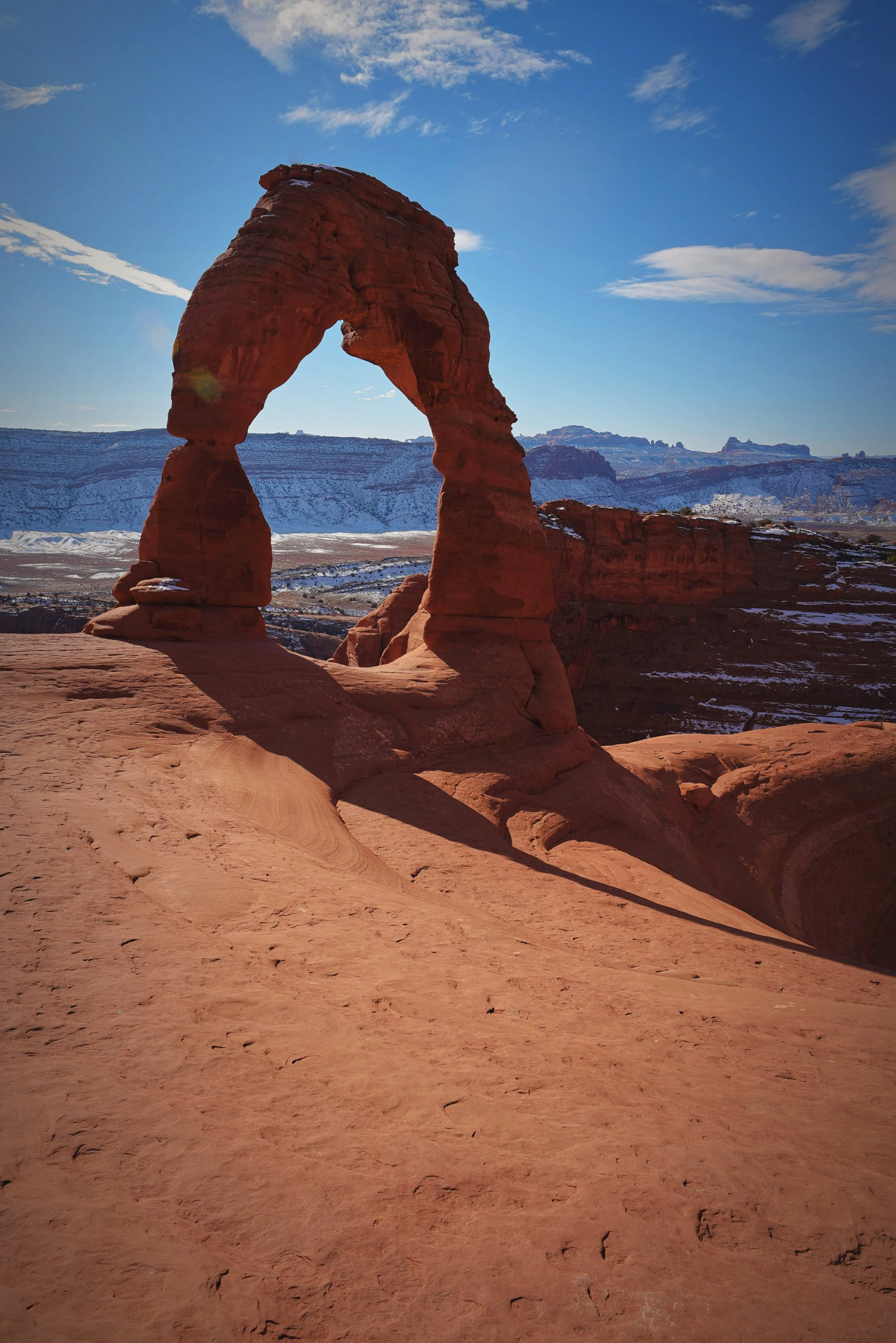 The sandstone bowl that Delicate Arch is on top of is shallow enough that you can walk along the rim around to the arch.