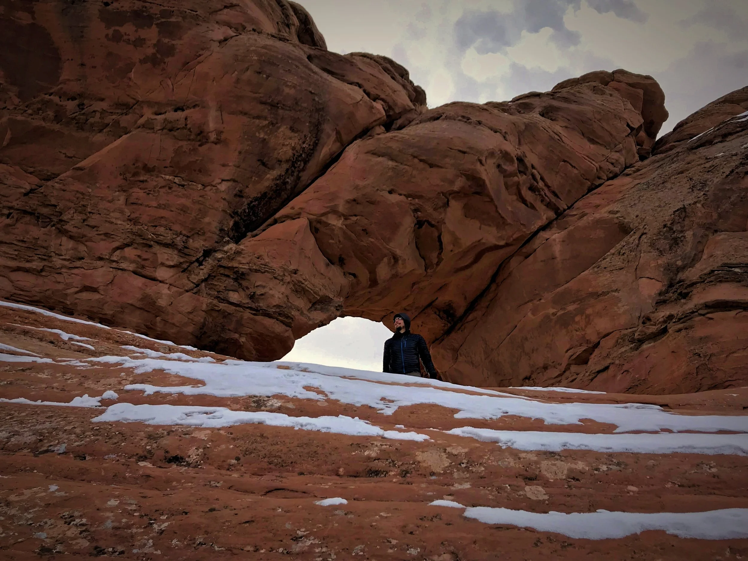 Ian stands inside Frame Arch, on the Delicate Arch trail.