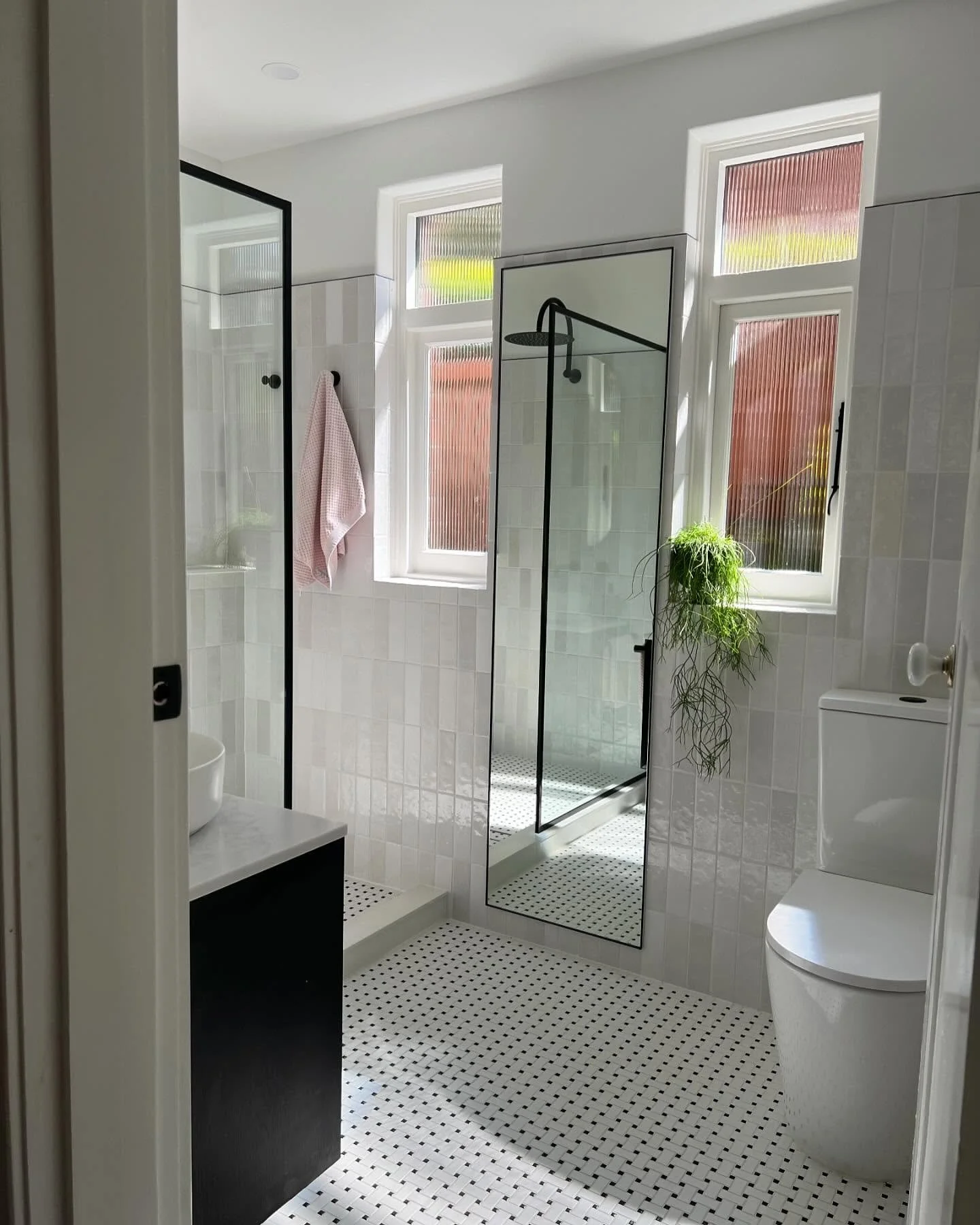 Gorgeous renovation of a teeny little bathroom in an Art Deco apartment.
 
We selected a black &amp; white theme to tie in with the heritage.
Features included underfloor heating, heated towel rail, large  shower area and new windows to let in the af
