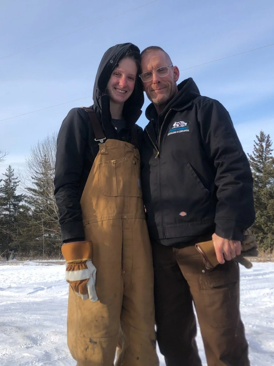 Owners of The Property Groomers smiling outside