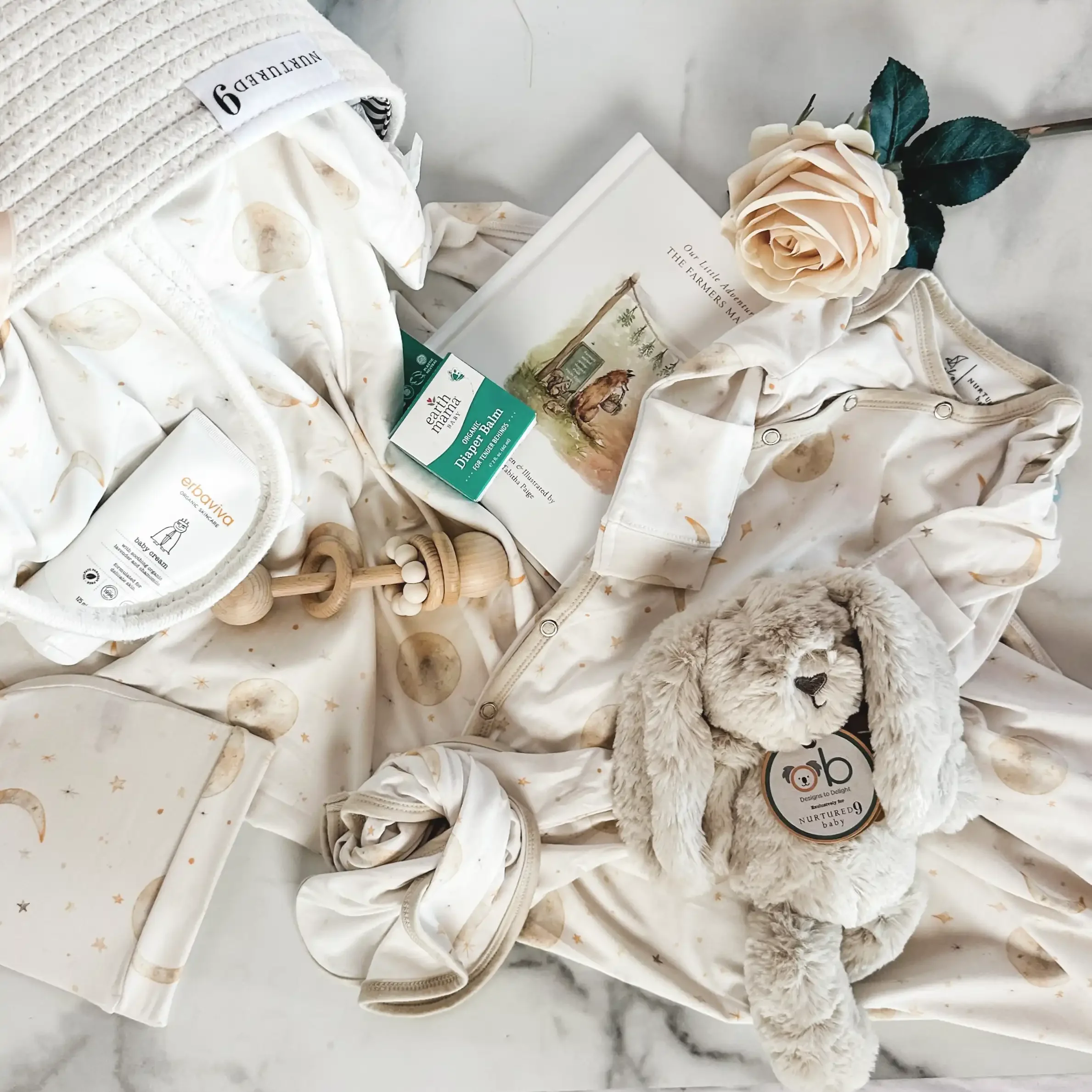 baby-shower-gift-basket-moon-and-stars-flatlay.webp