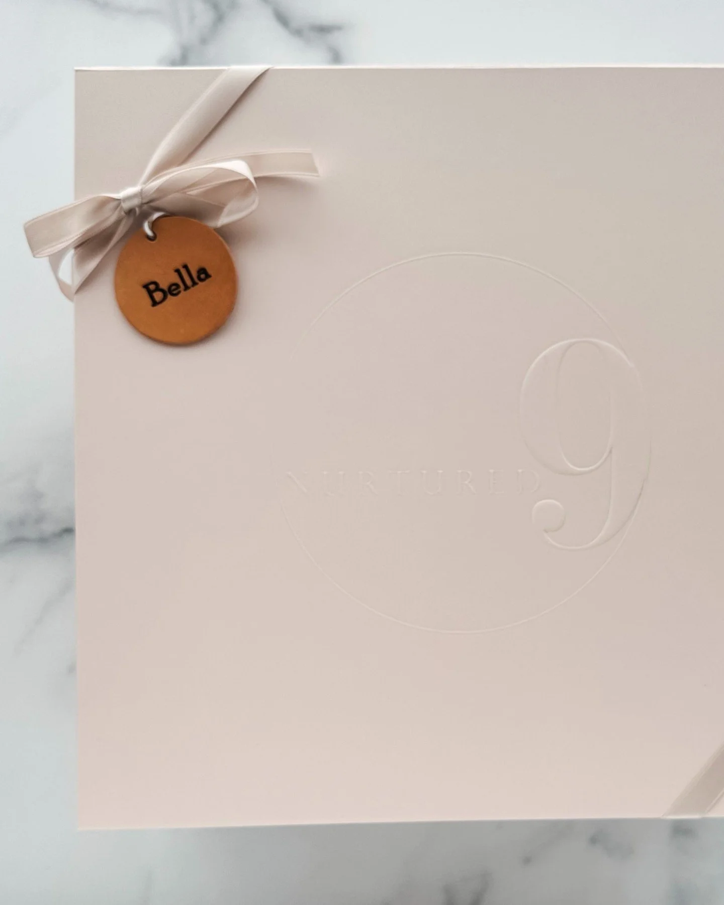 A Nurtured 9 gift box, personalized with a custom name tag for our little one on the way. 🤍 The small touches make all the difference.