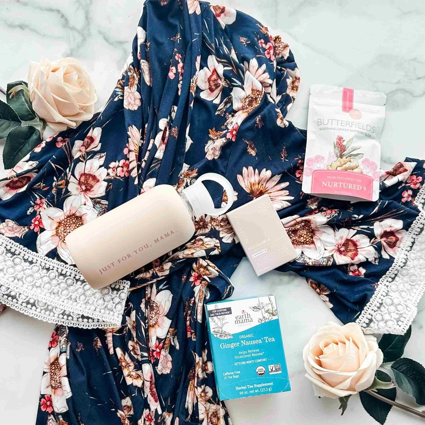 Our Congrats Pregnancy Gift Box now comes with a new robe option! Our navy floral maternity/postpartum robe sets a beautiful foundation for this gift curation filled with items to comfort and soothe a mom-to-be in early pregnancy!