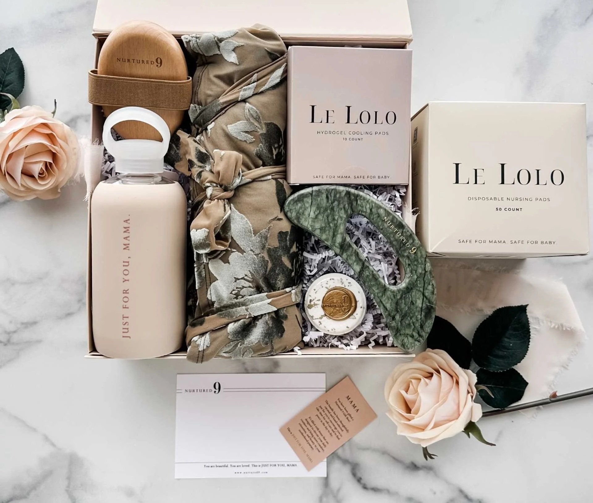 a postpartum care package with loungewear, self-care and nursing essentials for a new mom