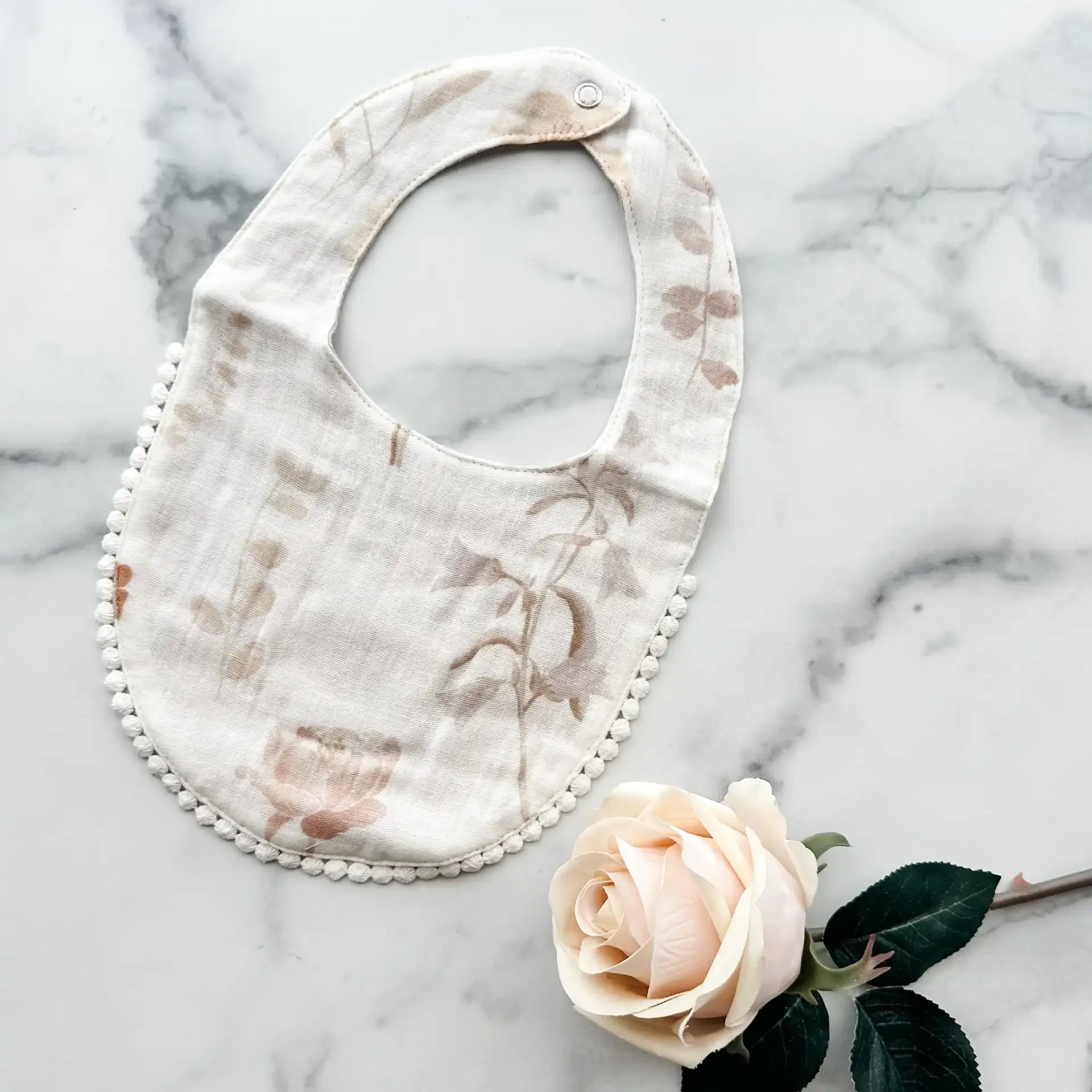 bib-white-floral.webp