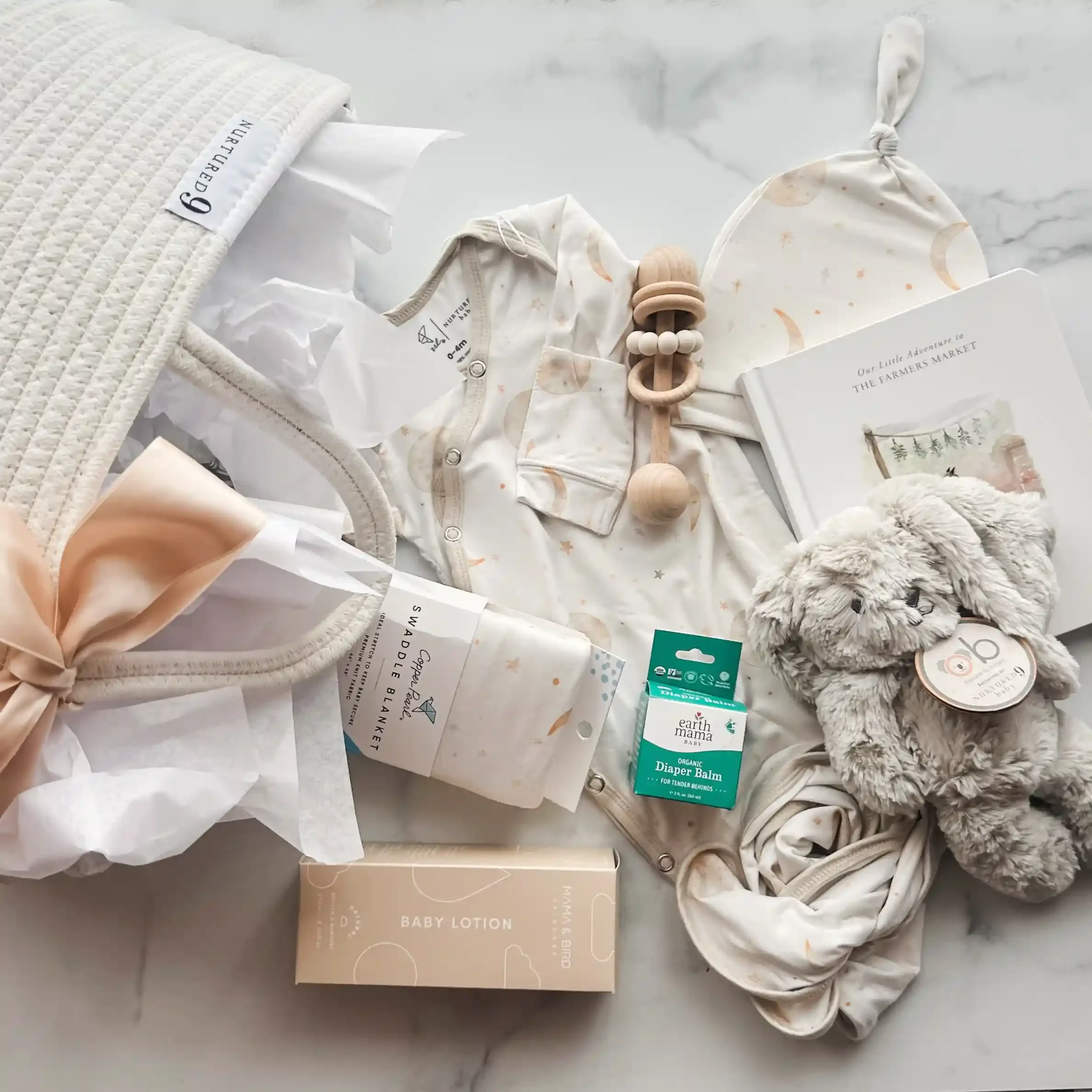baby-shower-gift-basket-moon-and-stars-flatlay.webp