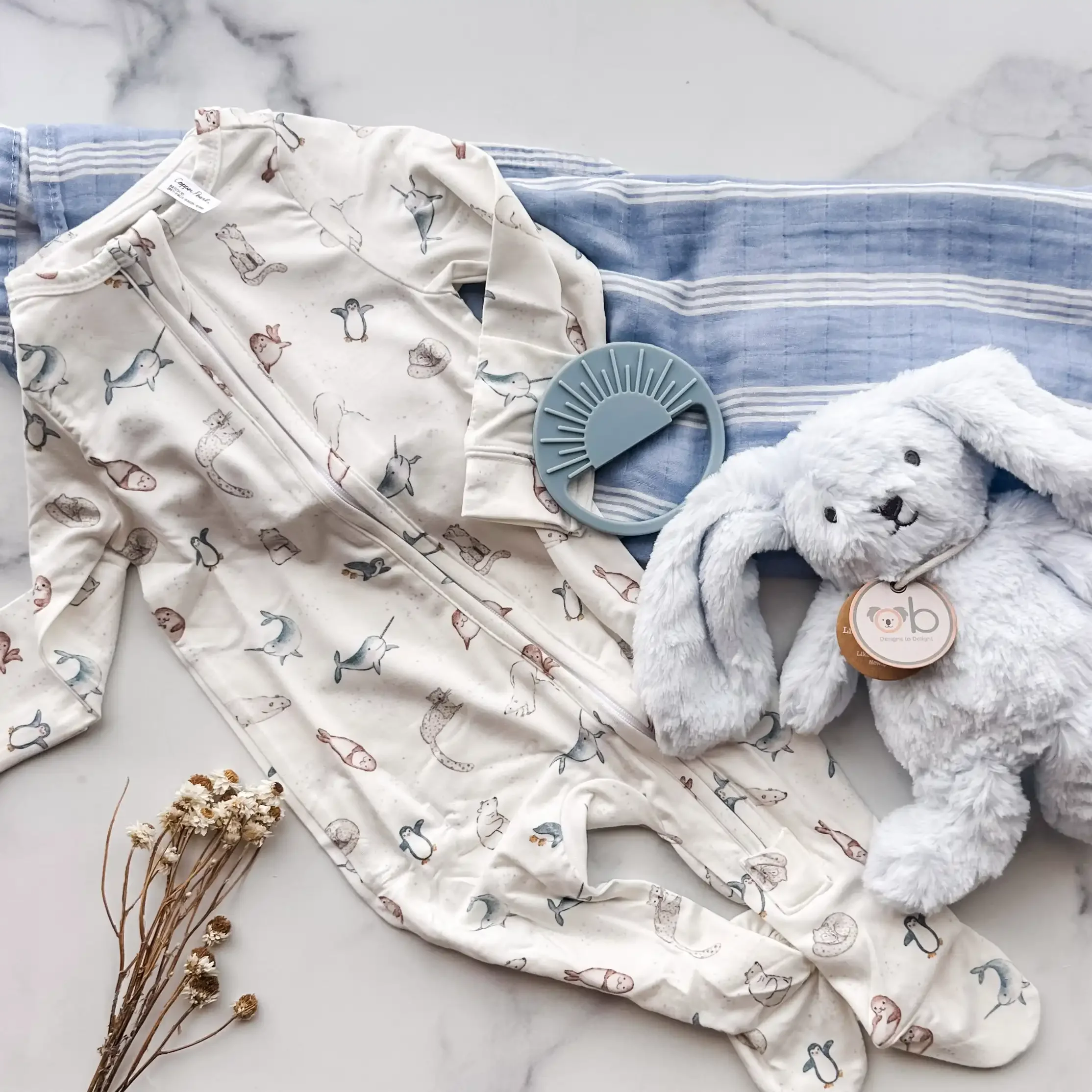 blue-baby-gift-box-arctic-animals-flatlay.webp