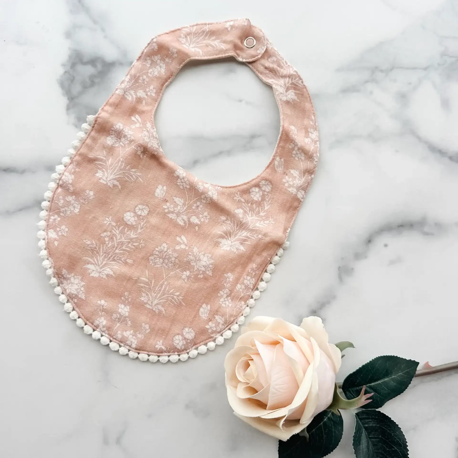 bib-pink-floral.webp