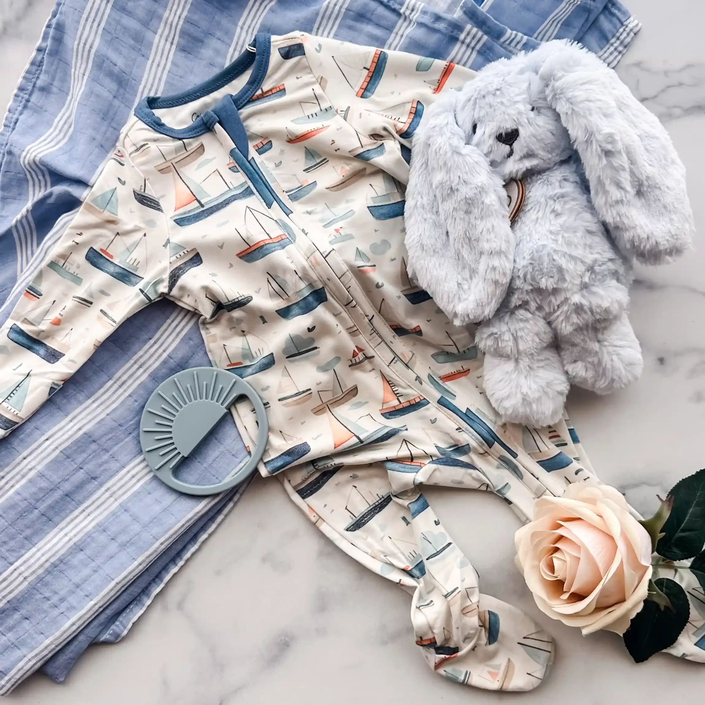 blue-baby-gift-box-flatlay-sailboats.webp