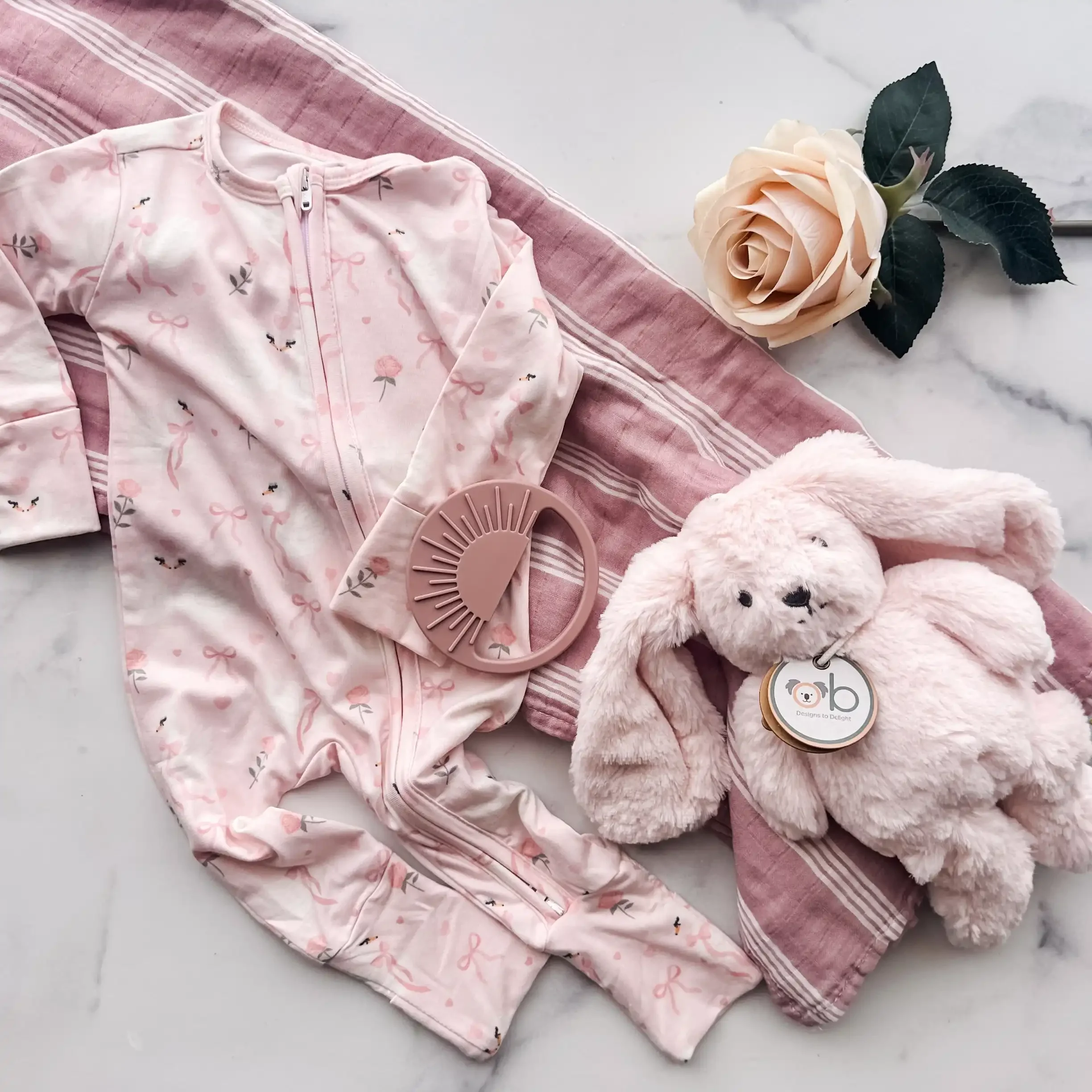 baby-girl-gift-box-swan-floral-flatlay.webp