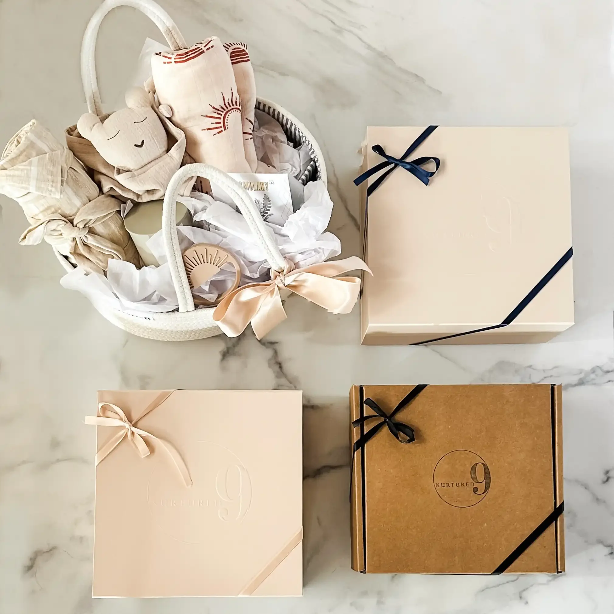 four pregnancy gift box options including a basket, luxe box, and kraft box
