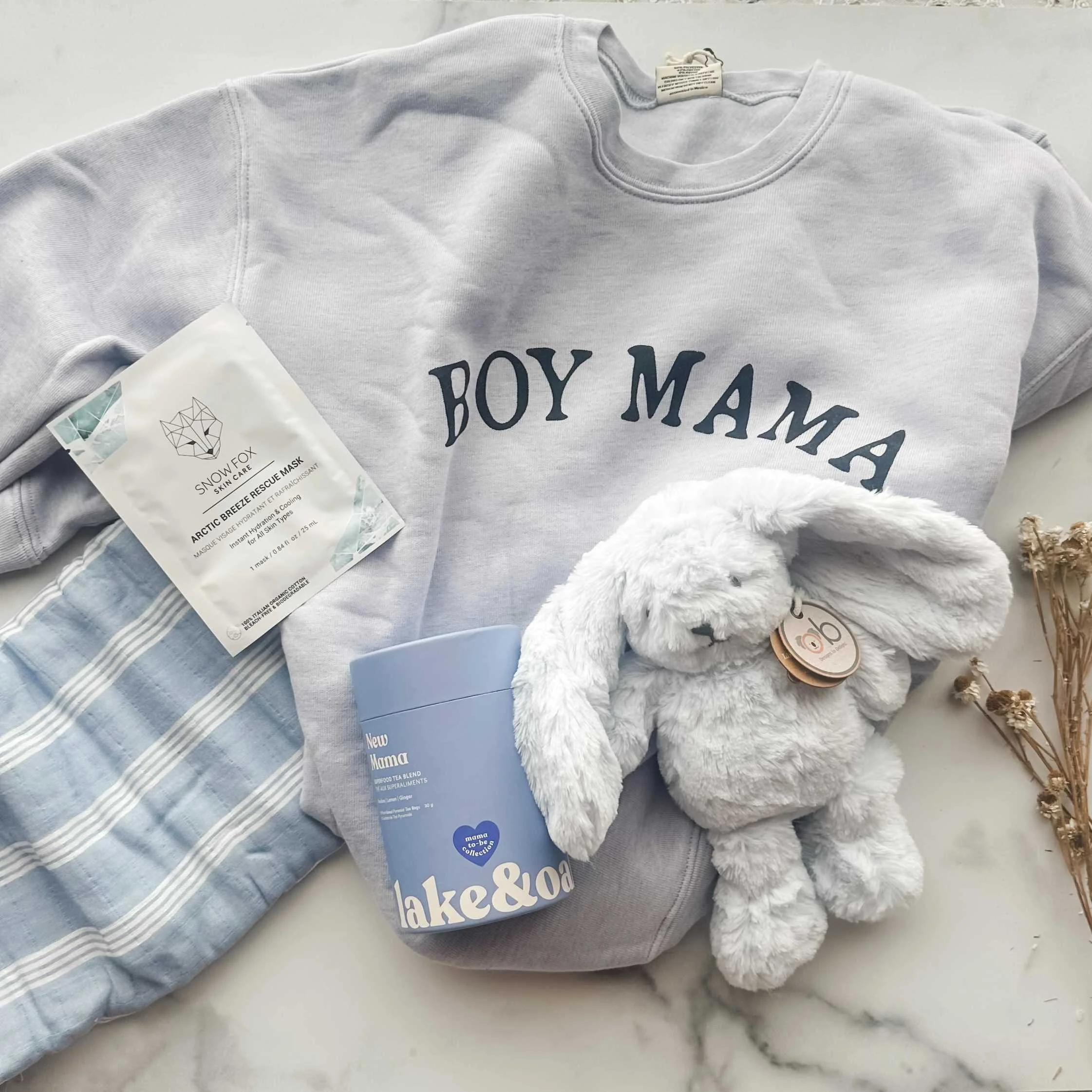 baby-boy-and-mom-blue-sweatshirt-flatlay.jpg