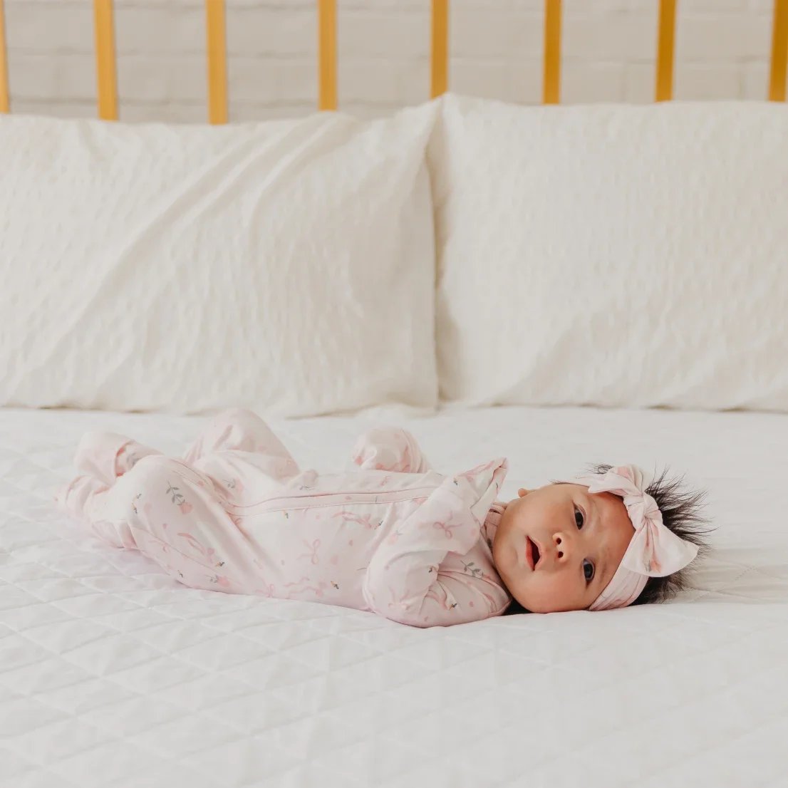 footie-copper-pearl-pink-ribbons-baby-1.webp