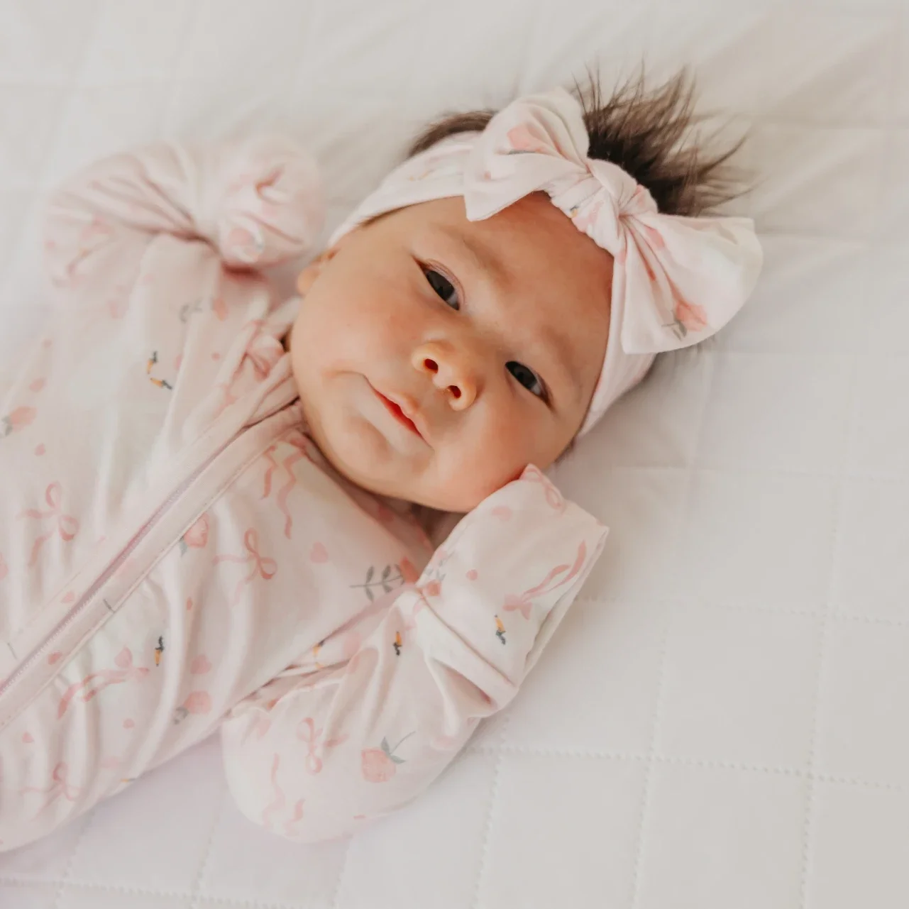footie-copper-pearl-pink-ribbons-baby-2.webp