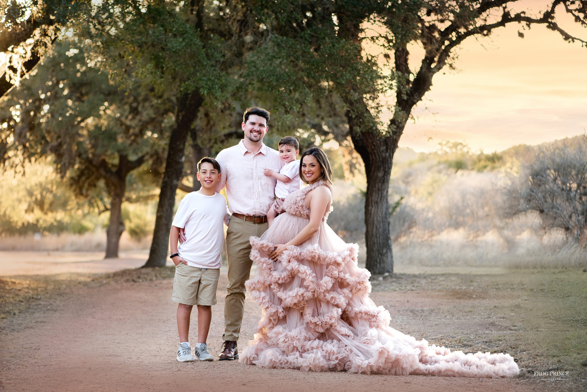 family posed outdoor maternity photography in san antonio