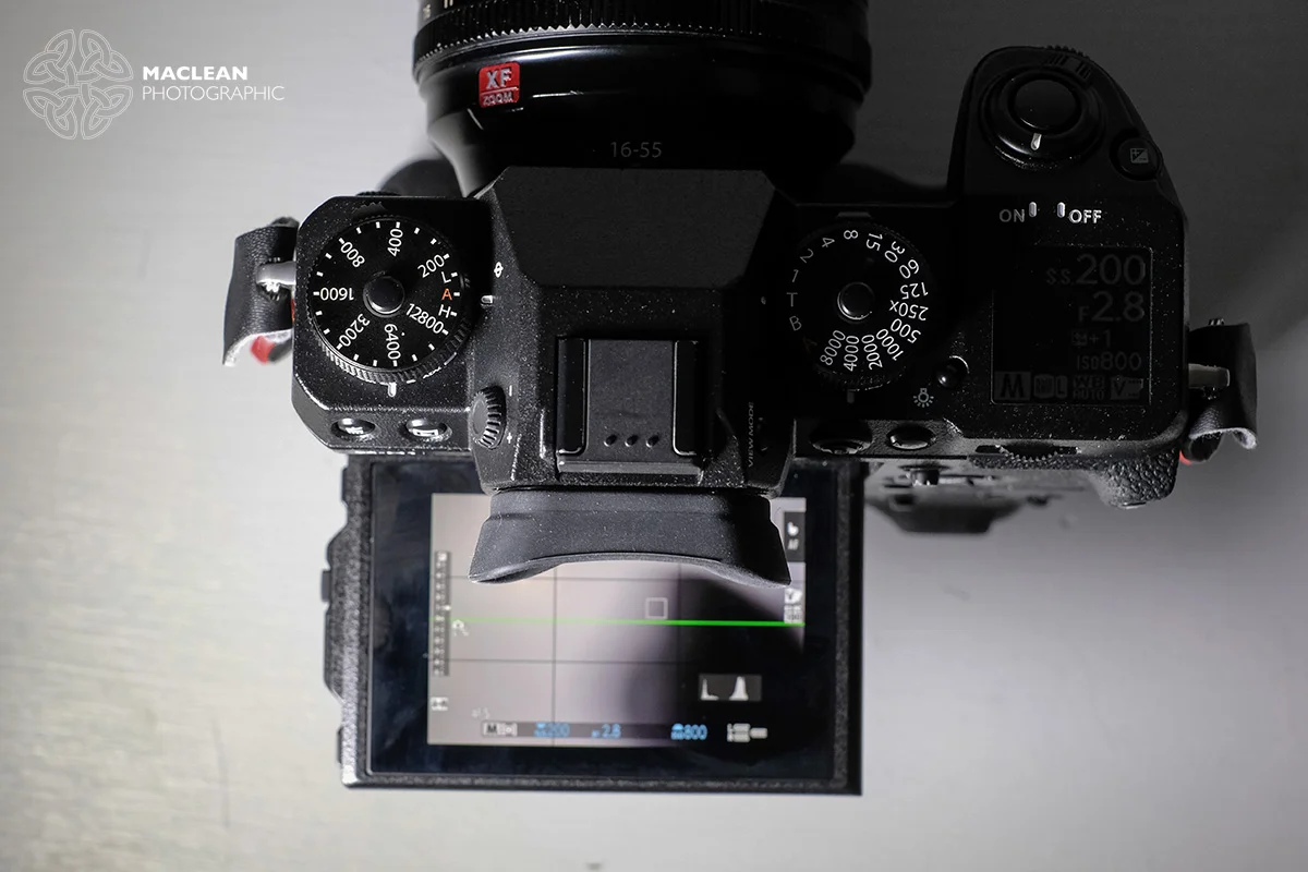 The eye cup in the X-H1 blocks the top the screen when using the camera in a low position.