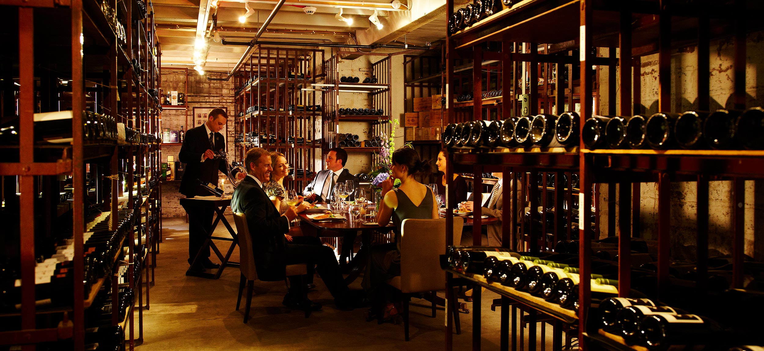 Dinner in the wine cellars, Gleneagles, Scotland.  Inetrior photography by Mike Caldwell