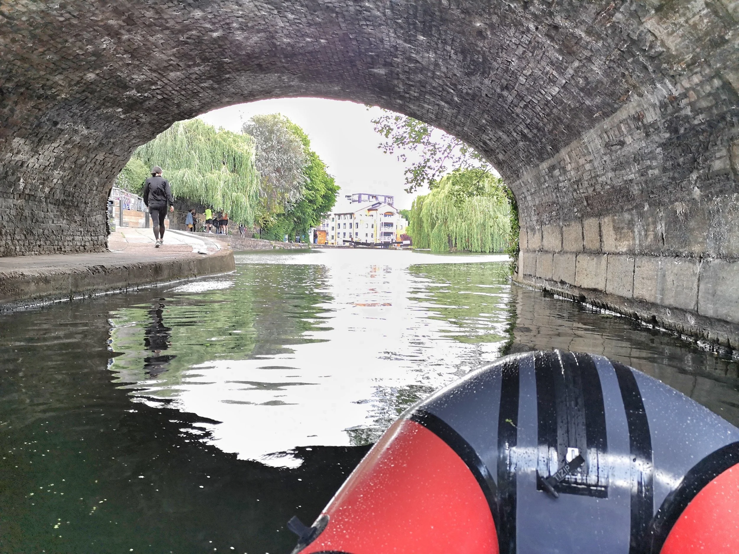 Then down to City Road Lock past weeping willows. Unlike the stretch to the west of Camden, this whole section of canal is beautifully maintained and well used by cyclists and runners. On the day I was out occasional rain storms swept in but i just paused under the many bridges to let them pass and then continued on my way.