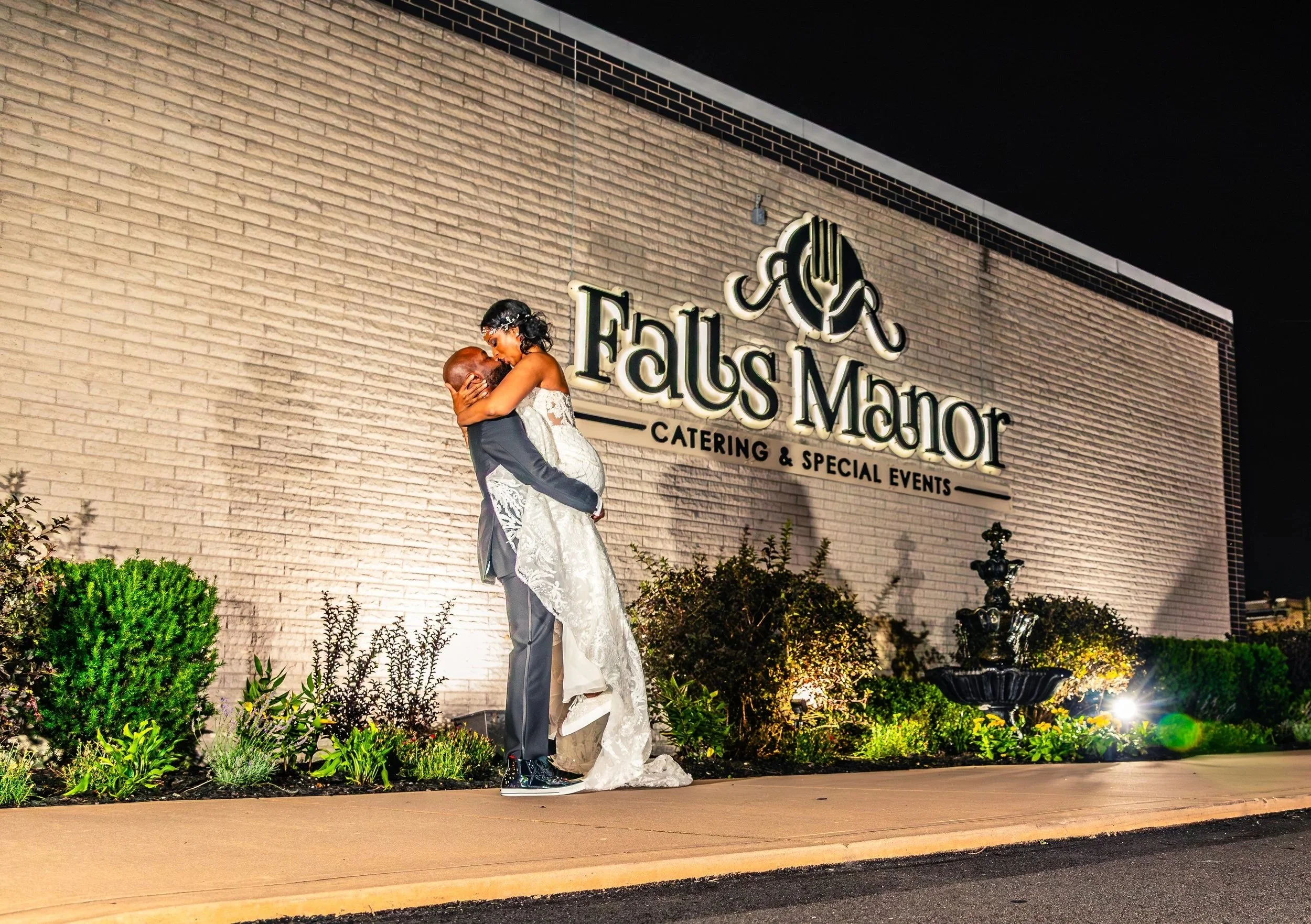 young black couple groom lifting bride, wedding, night shot, Falls Manor,  Pennsylvania