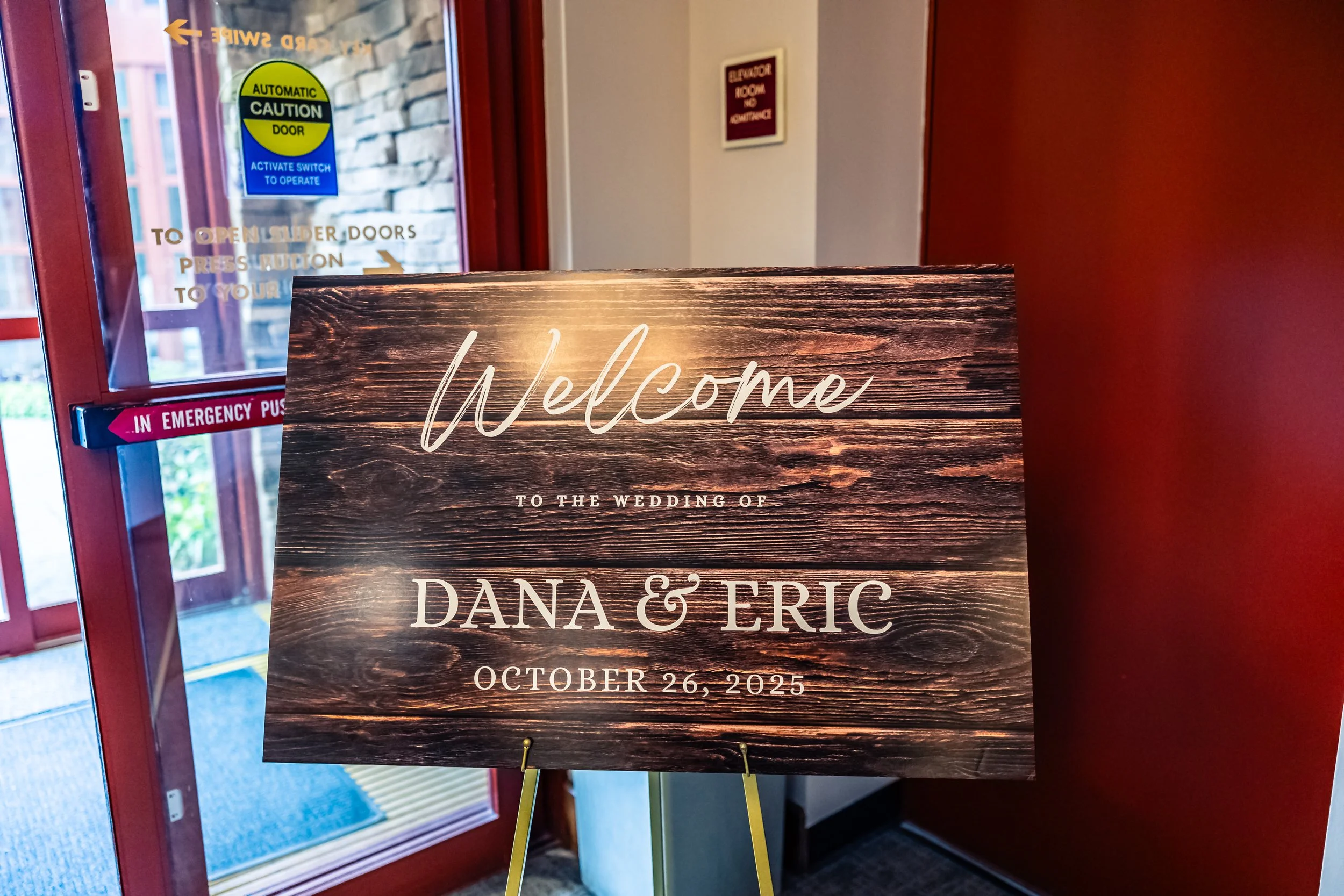 Wooden wedding sign welcoming guests to Dana and Eric's wedding on October 26, 2025.