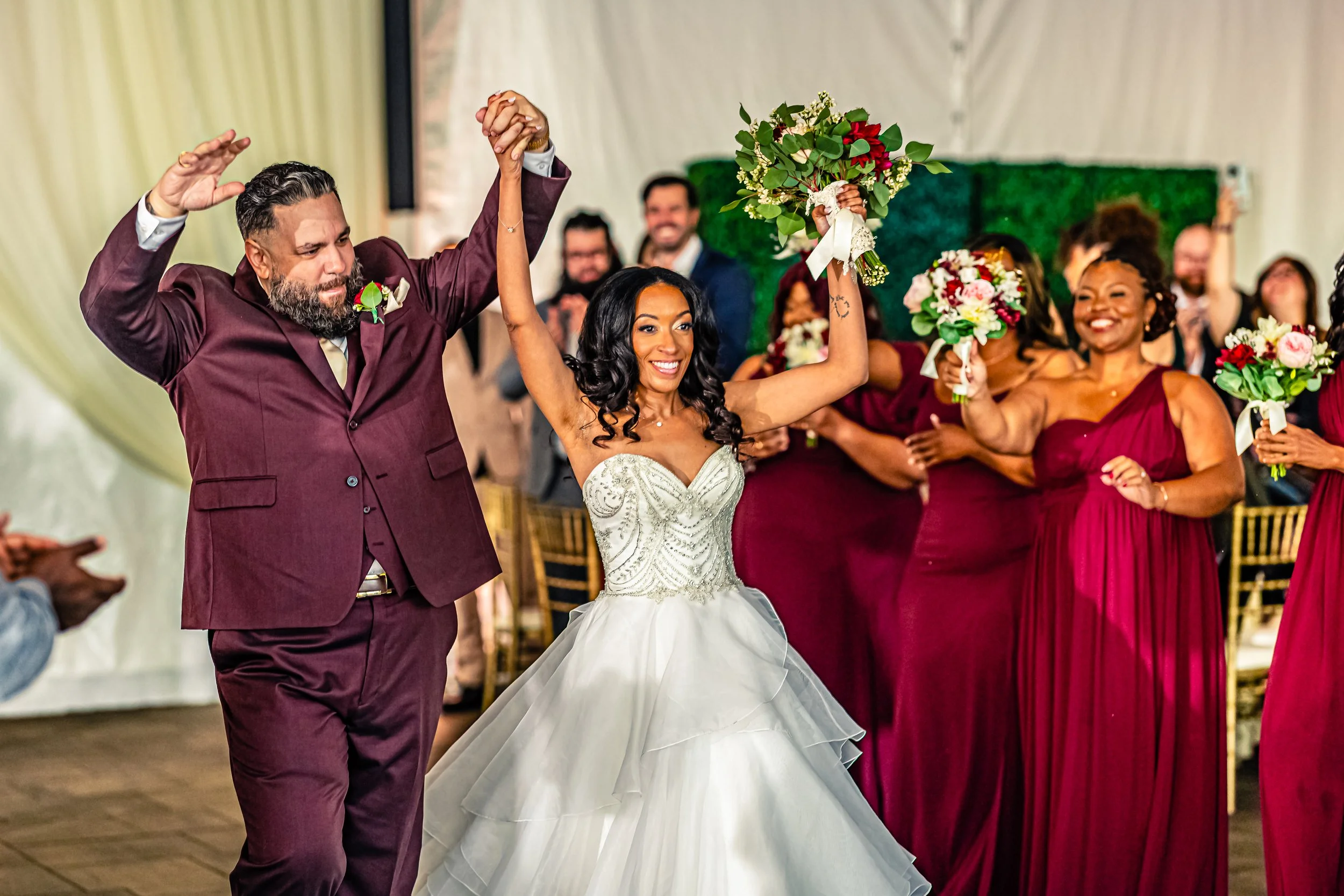 mixed race couple entering the ballroom with wedding party in the background, wedding, Penn Rynn, Philadelphia Pennsylvania
