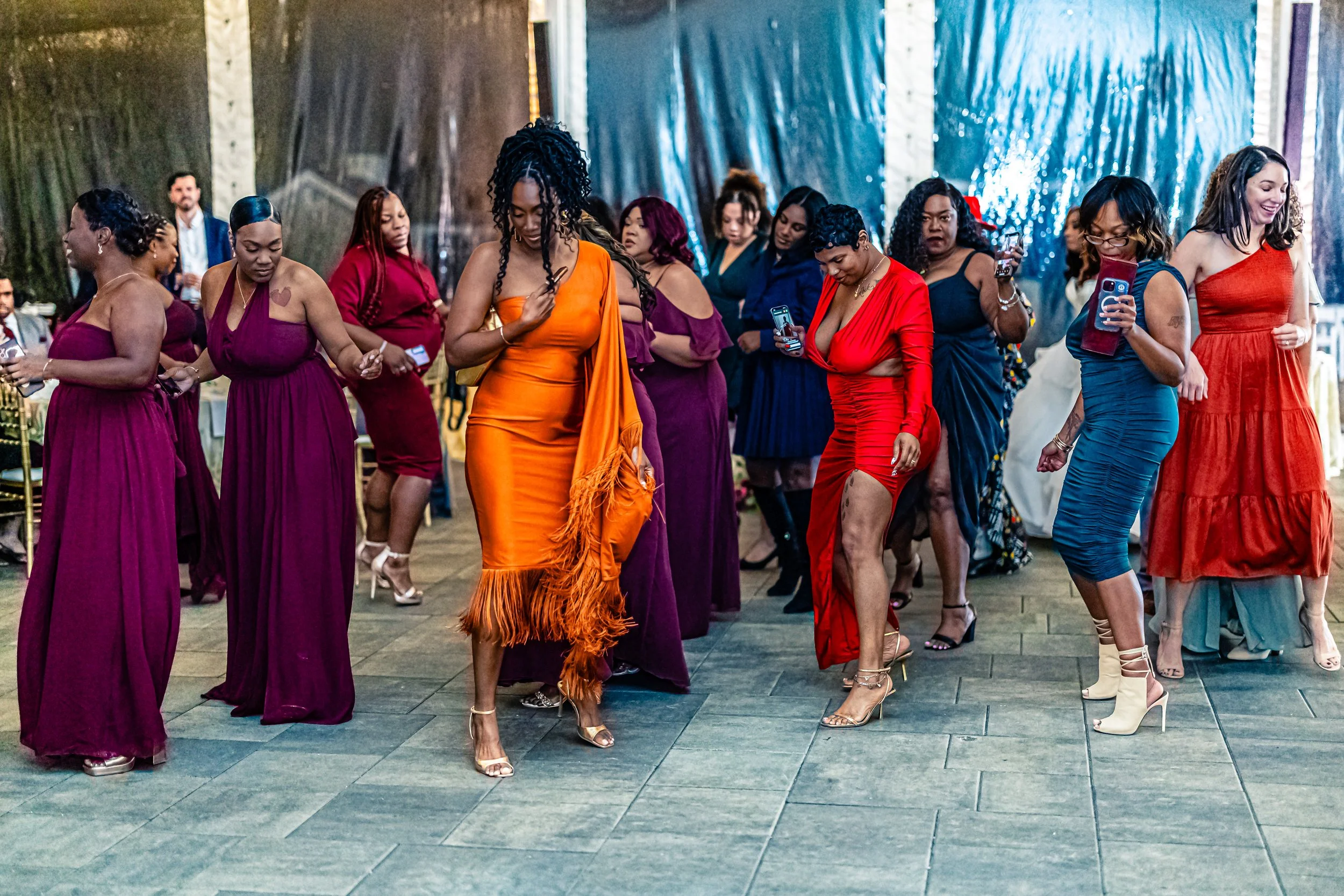 A group of women dancing at a celebration or party.