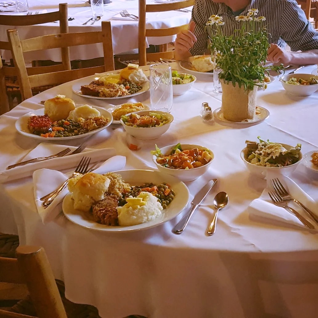 Linens and plates for a wedding.