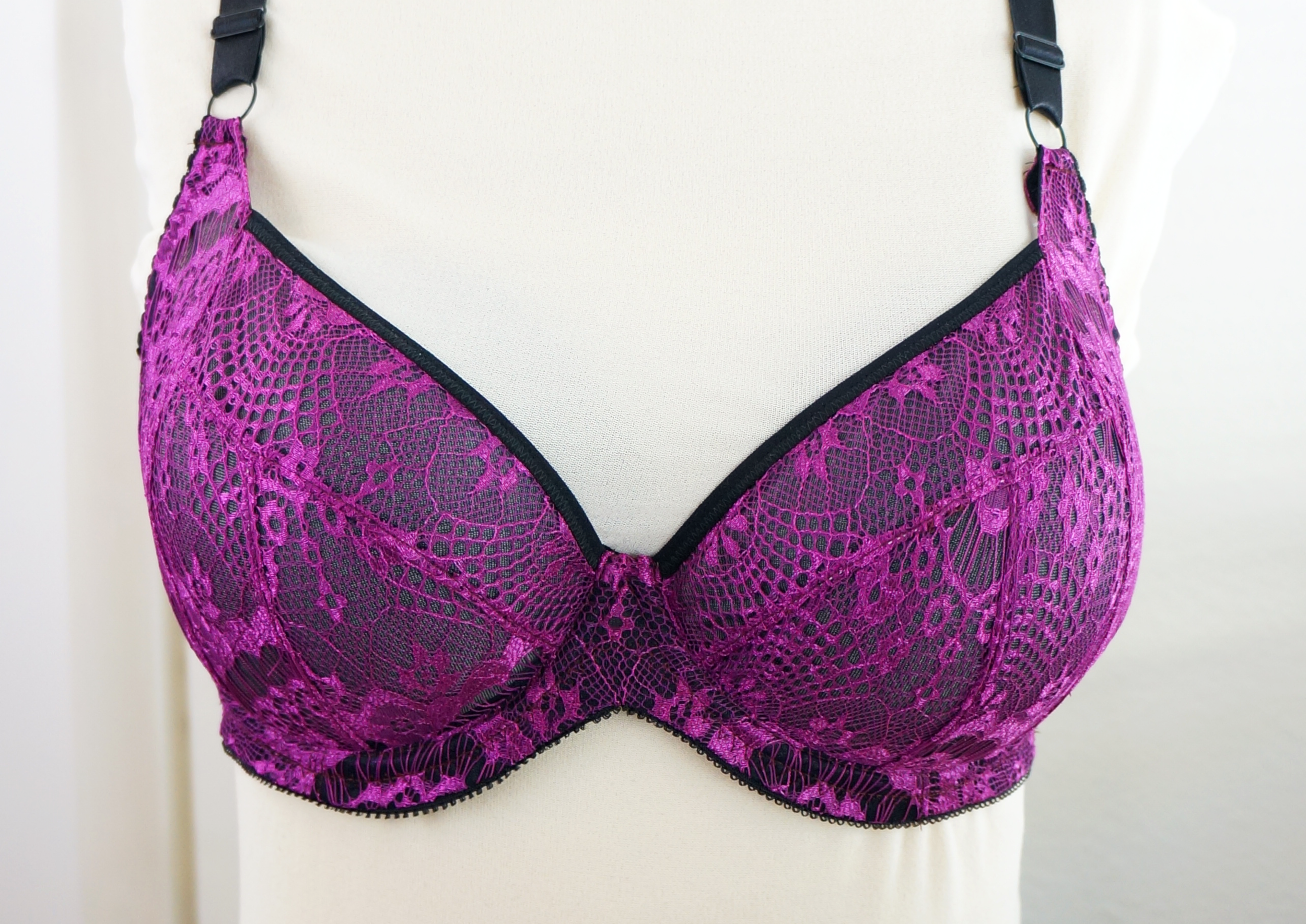  Roughly a 36E with reduced bottom cup height. 